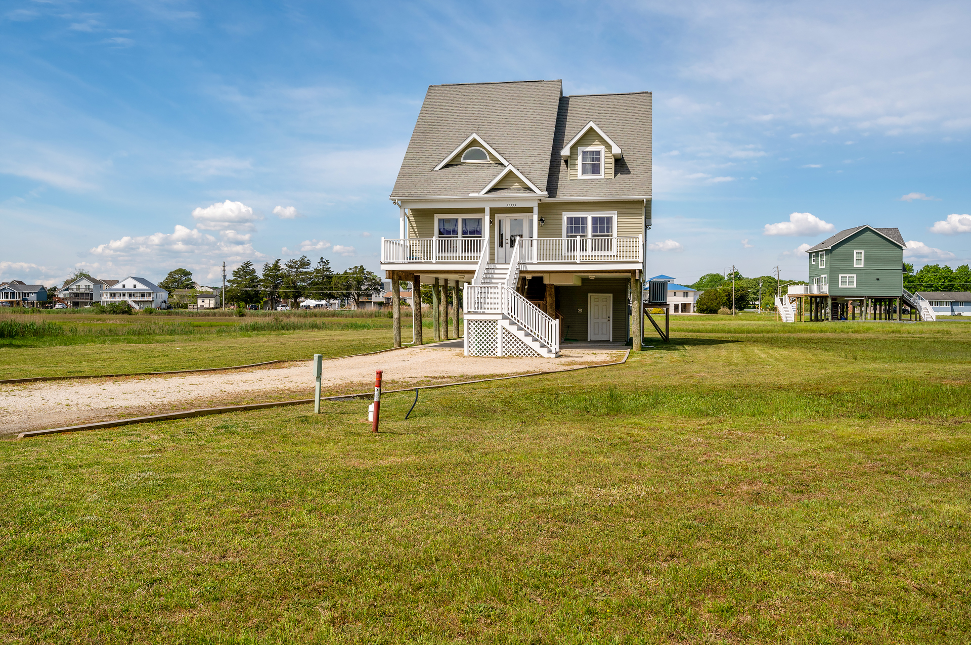 Coastal Cape good looks, and you can walk to all of the Cove's Amenities (Fees Apply).