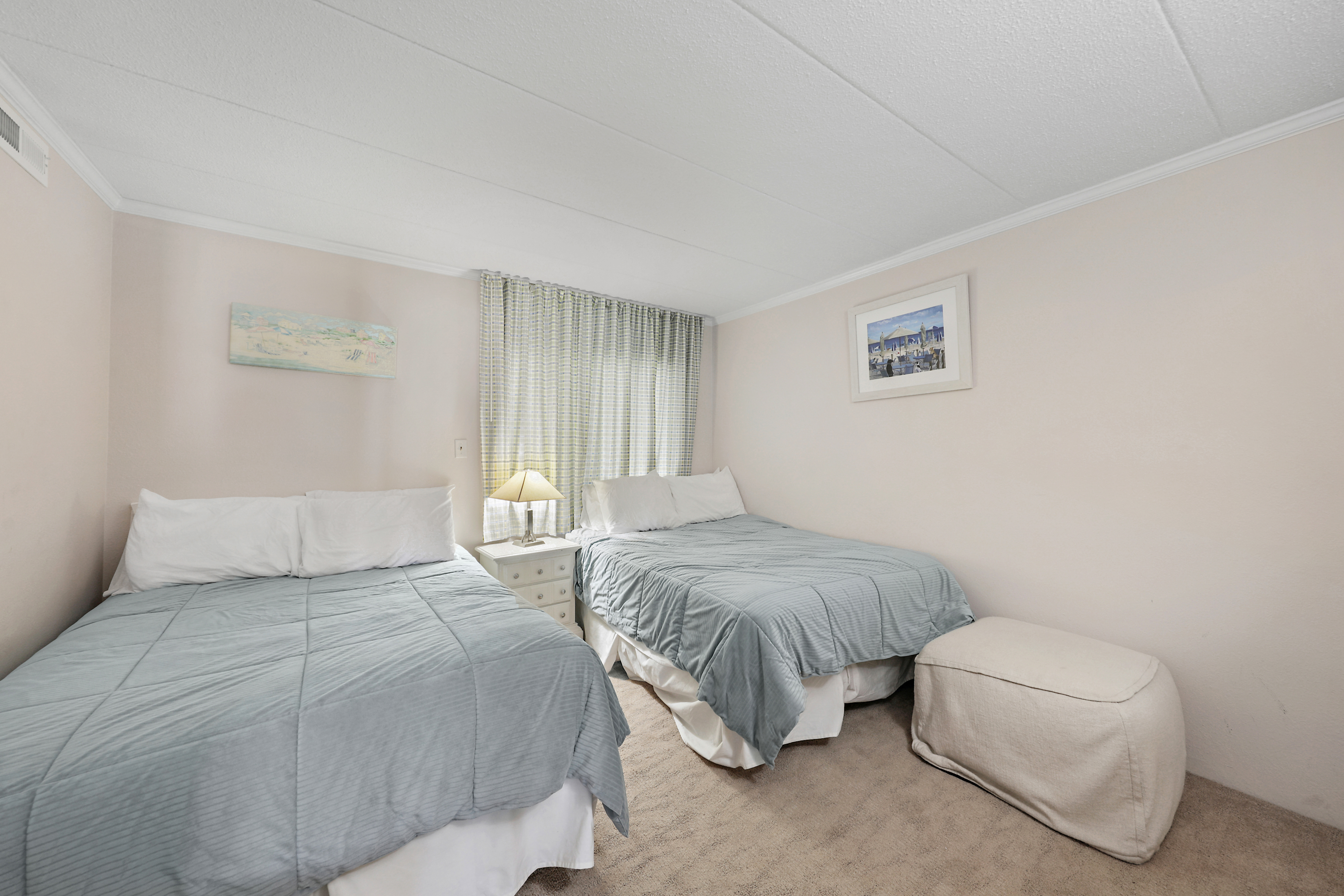 The fresh decor and cozy bedding of this room will have your special loved ones sleeping like a baby.