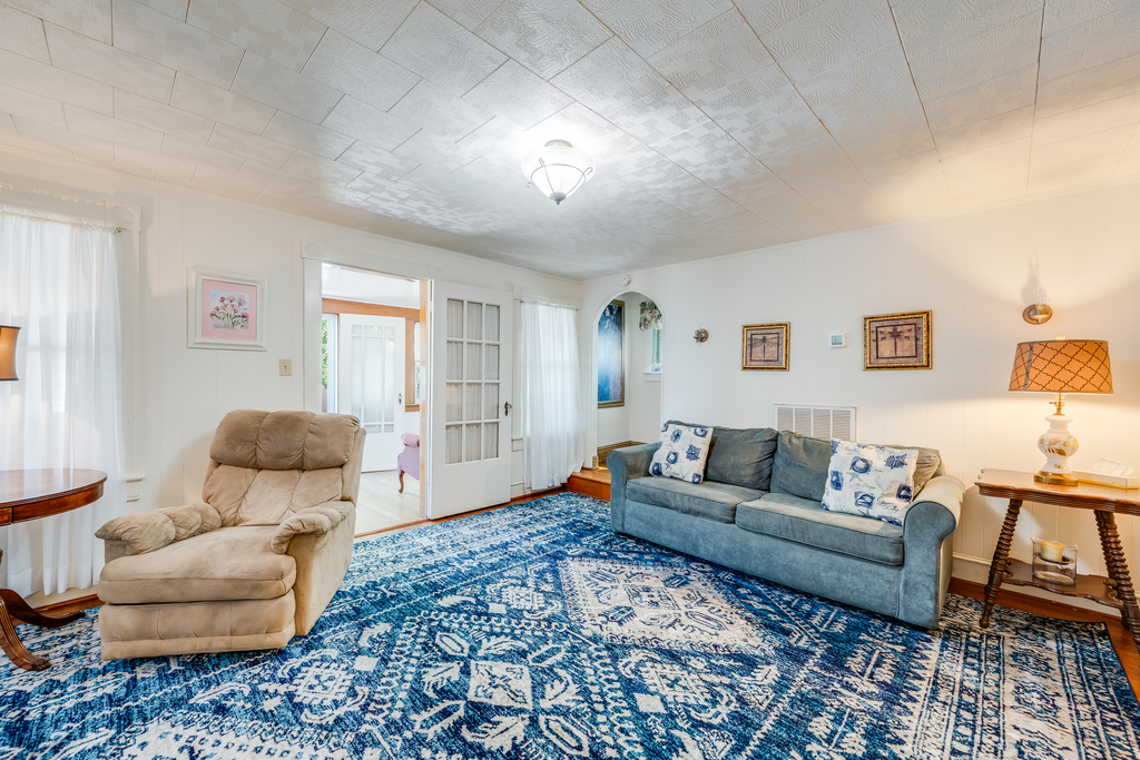 Relax in the Living Area with comfy furnishings and shades of blue.