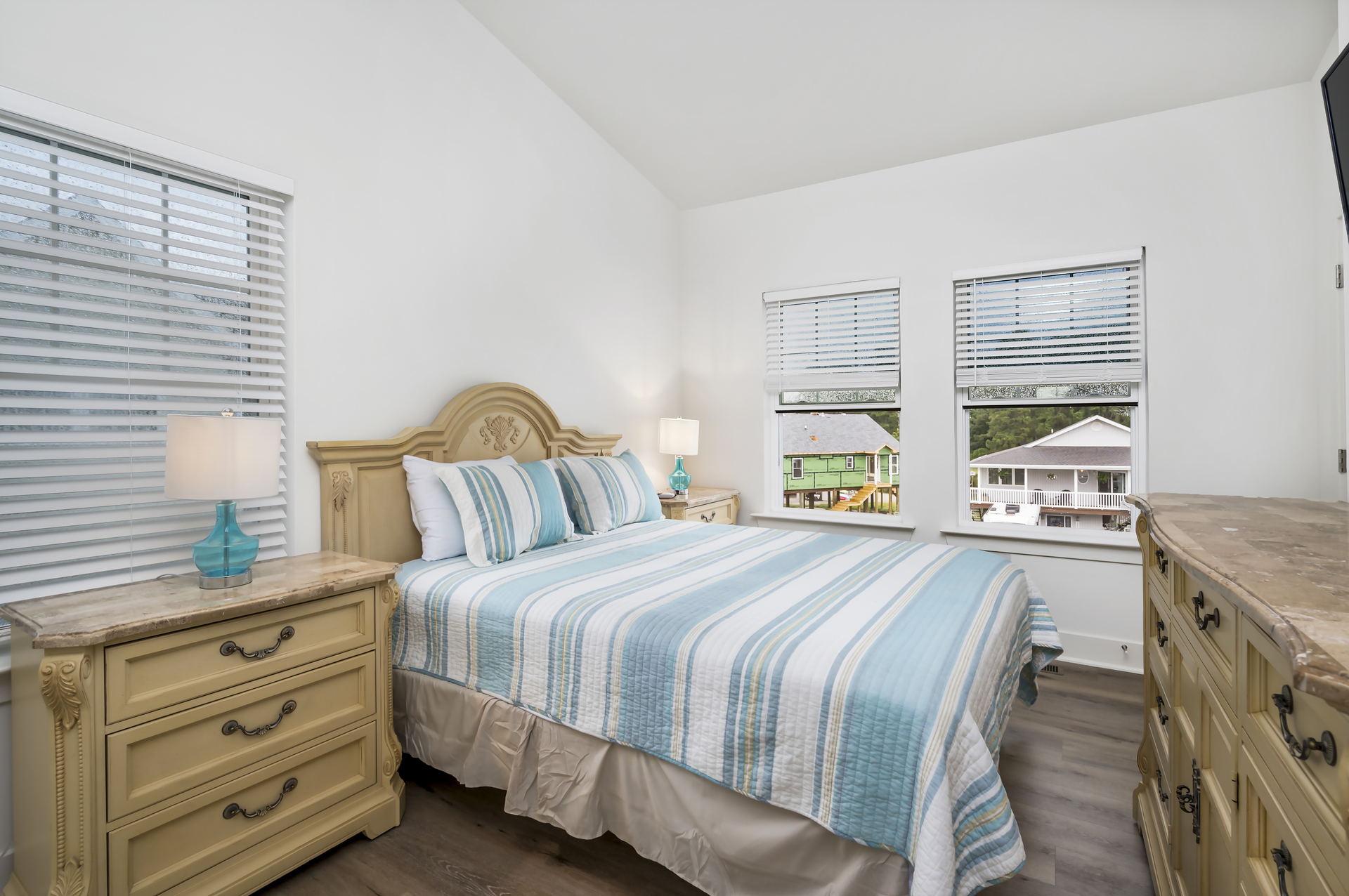 On the top floor, Bedroom 4 has another comfy Queen Bed.