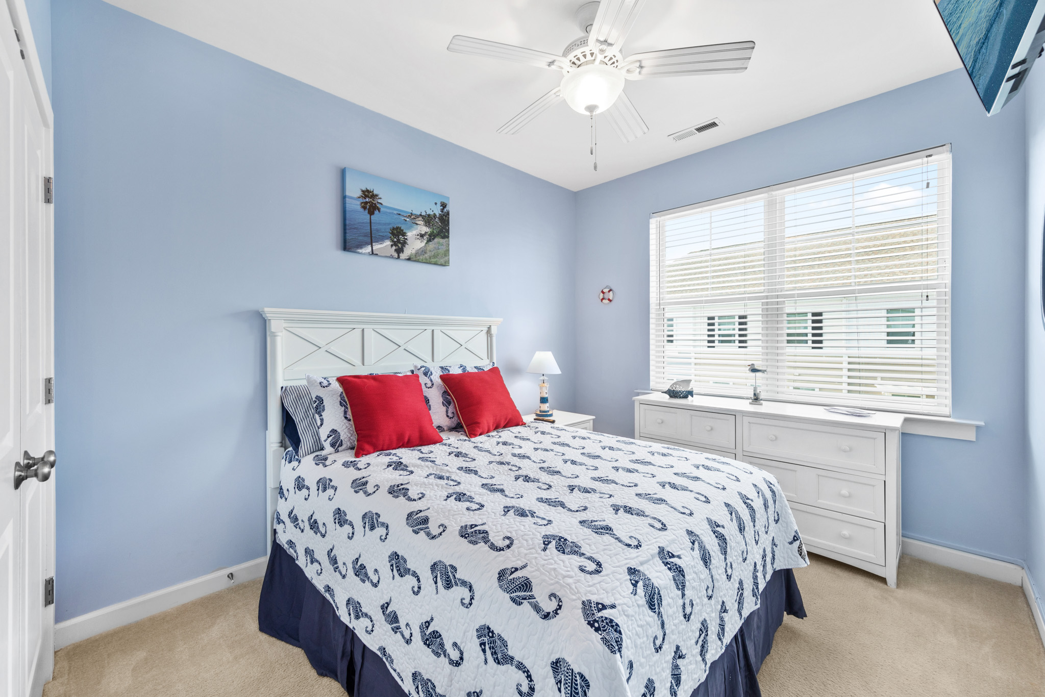 Bedroom 2 is bright and nautical!