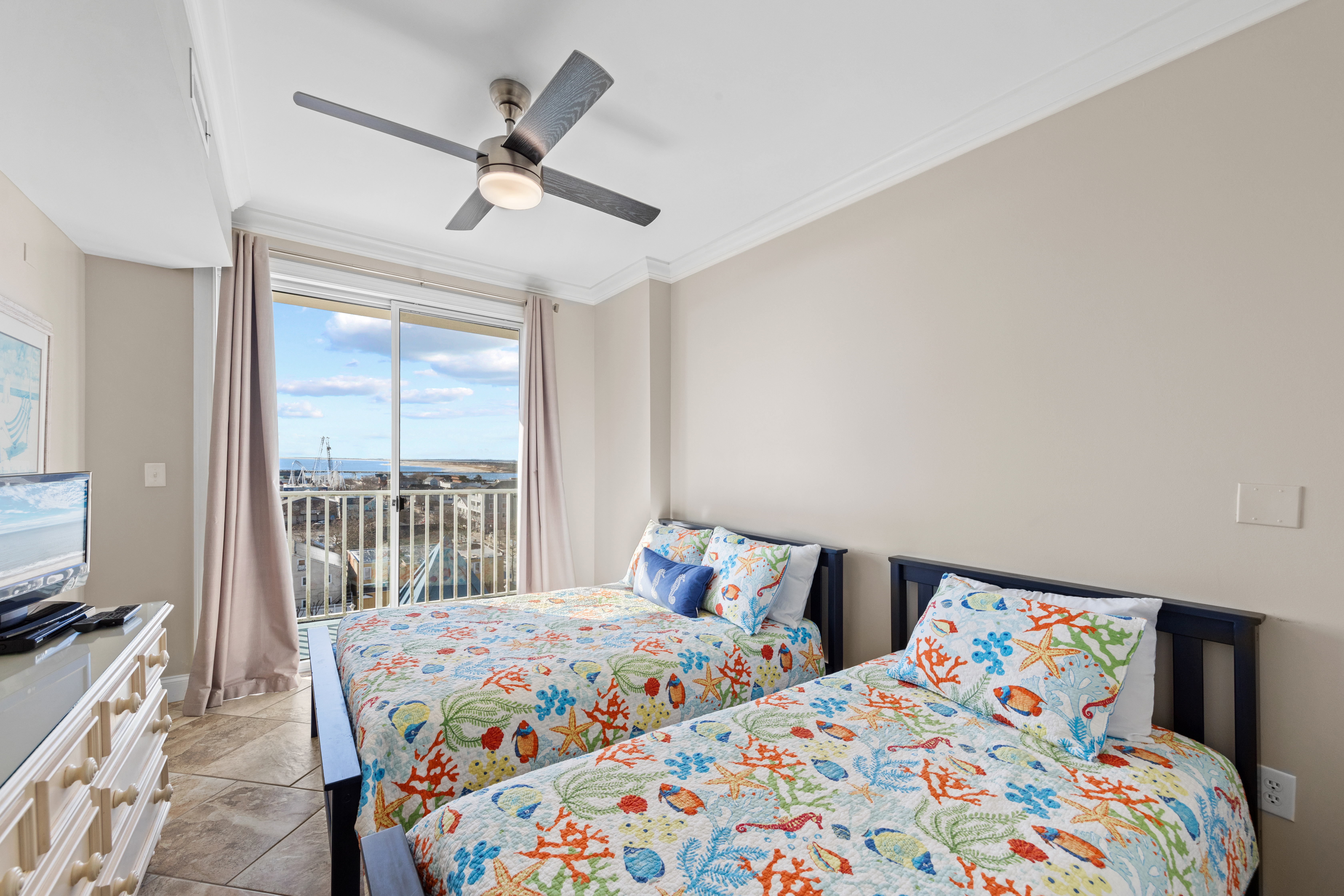 This room has a large Slider with loads of natural light and access to the Balcony