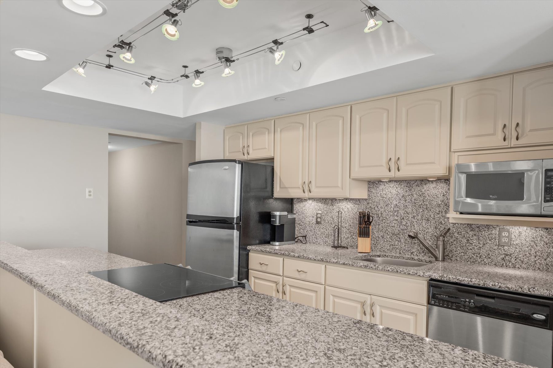 Elegant cabinetry and modern fixtures provide a polished, high-end feel to this beautiful kitchen.