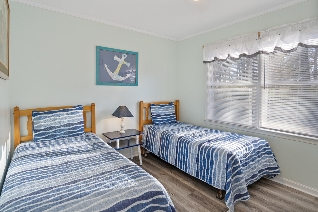 Bedroom 2 is bright and beachy and has 2 Twin Beds.