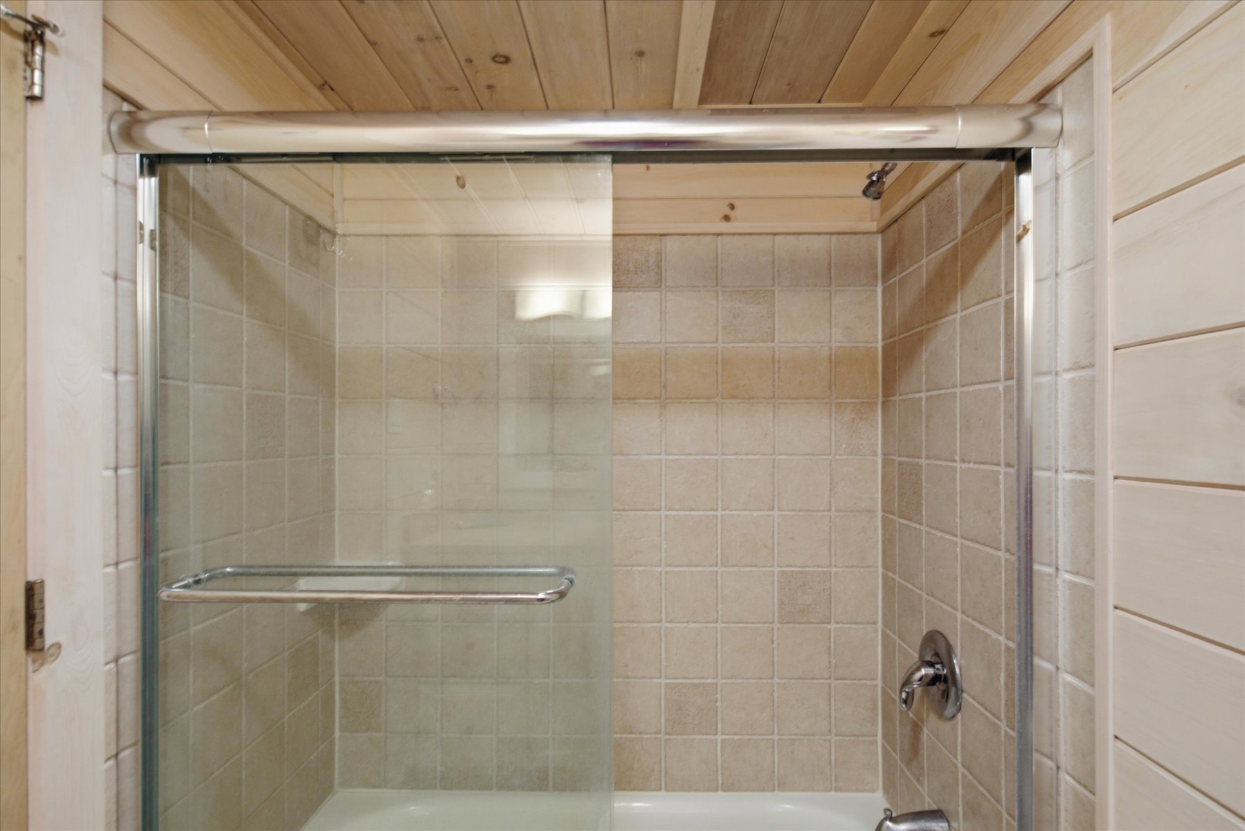 Rinse off the day in the custom tile Shower/tub combo.