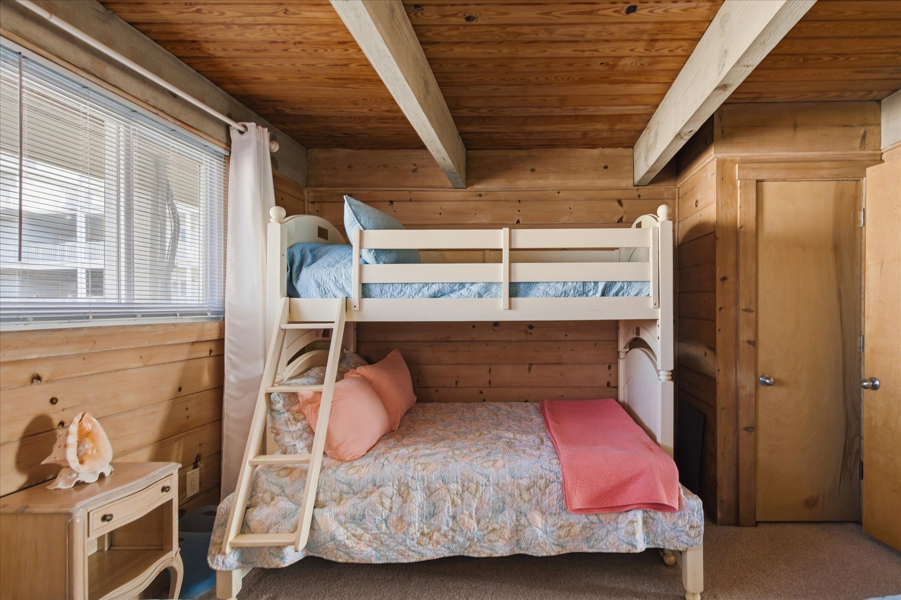 Features 2 Twin Beds and a Pyramid Bunk (Twin over Full)