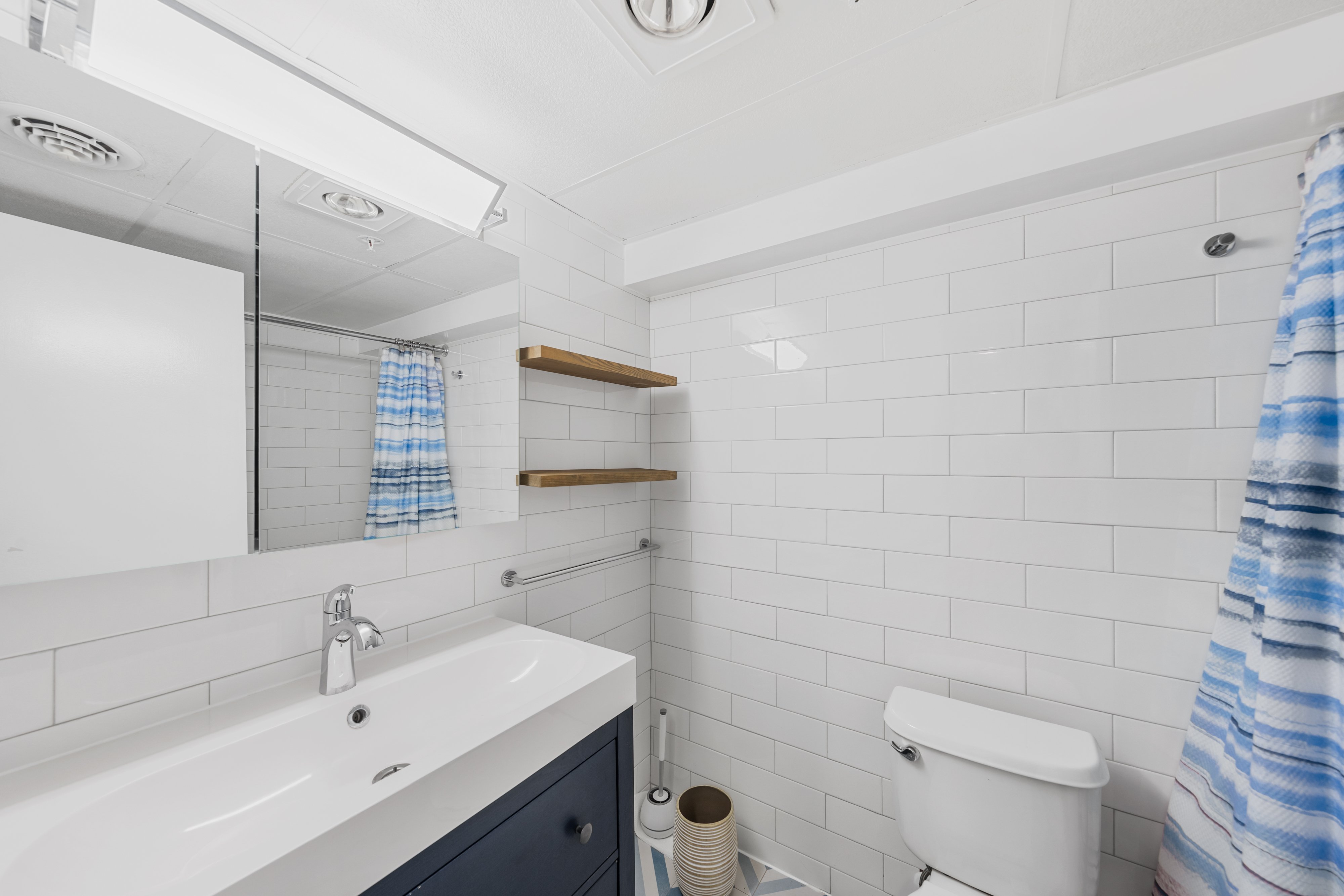 The Shared Full Bath is conveniently located near the Kitchen and Bedroom 2.