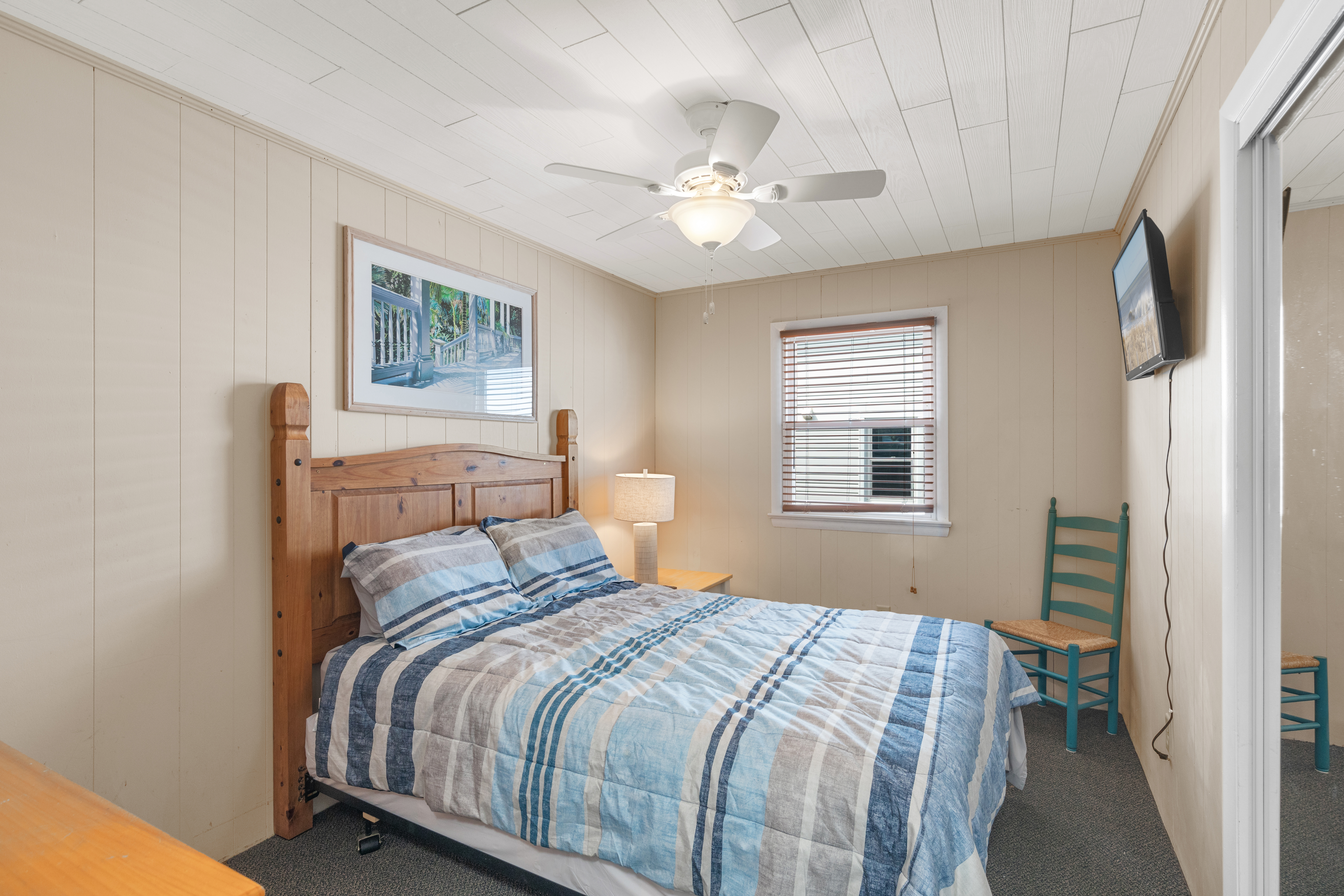 The Primary Bedroom is a spacious room, sleeping 2 in a cozy Queen Bed.