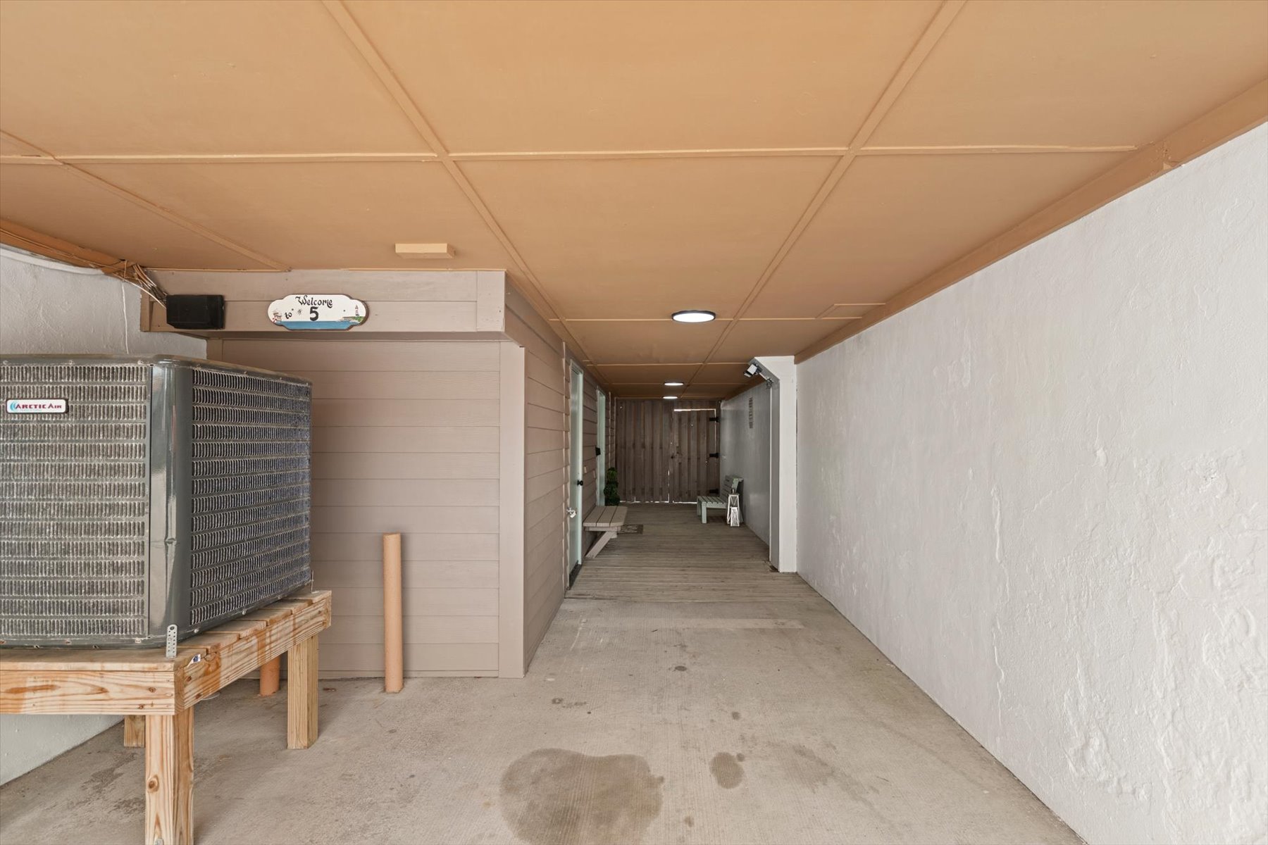 Outdoor entry area with covered carport