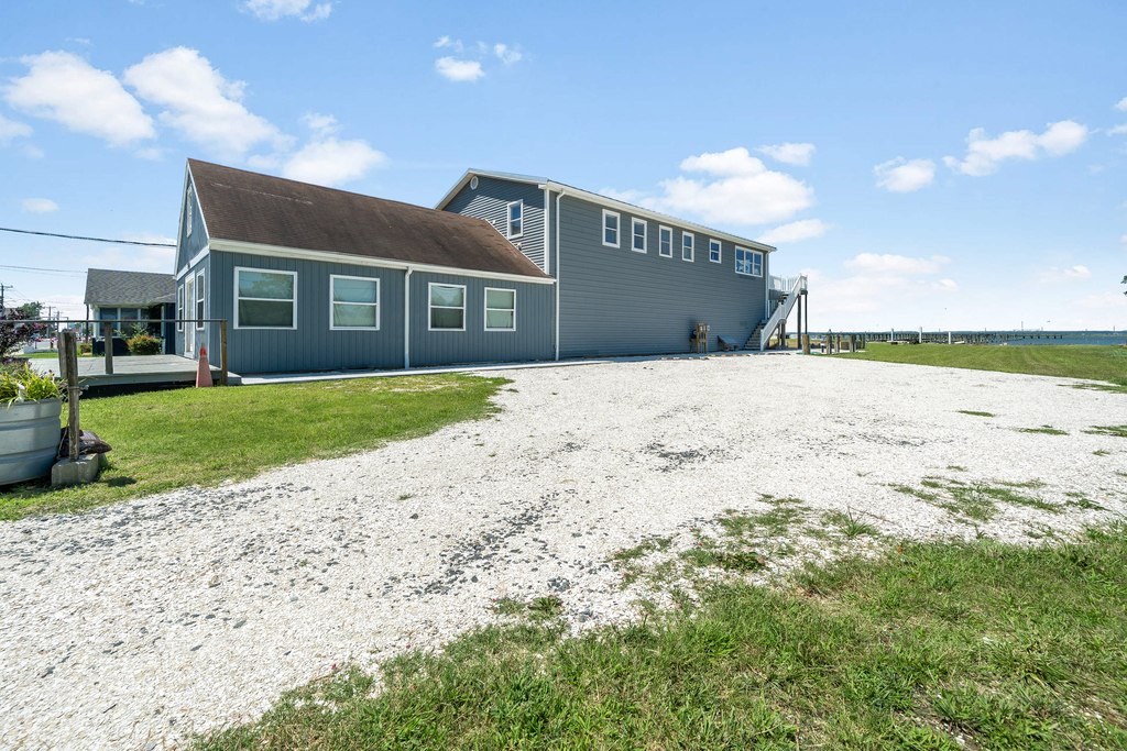 Large parking area and spacious yard.