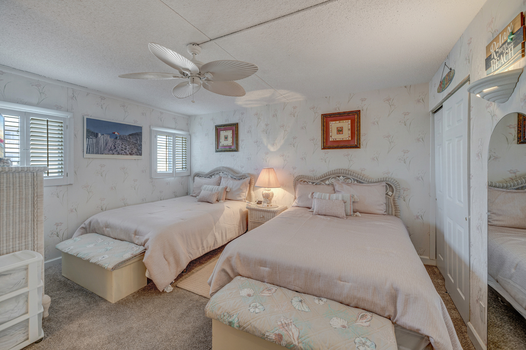The Bedroom features 2 Cozy Queen Beds!