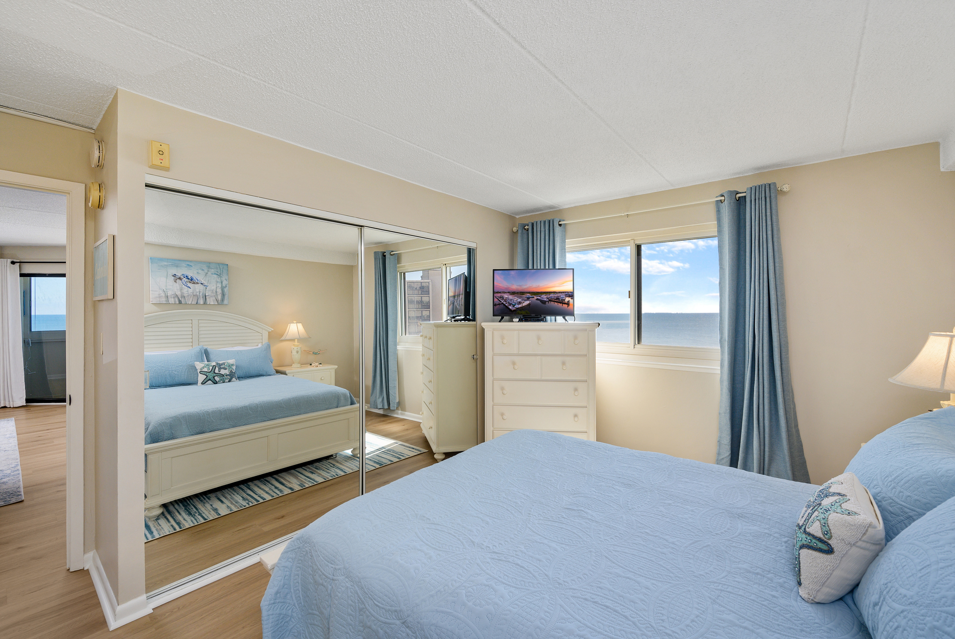 Bedroom 2 has a Flat Screen TV and even Views of the Beach!