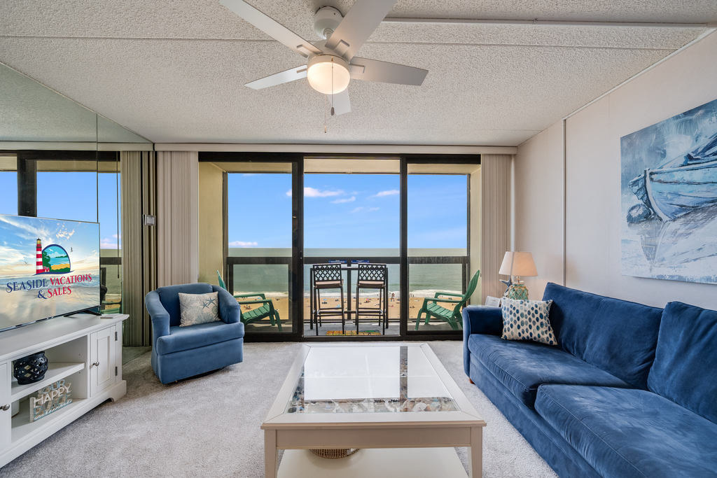 Massive floor-to-ceiling windows bring the beauty of the beach right into your living room.