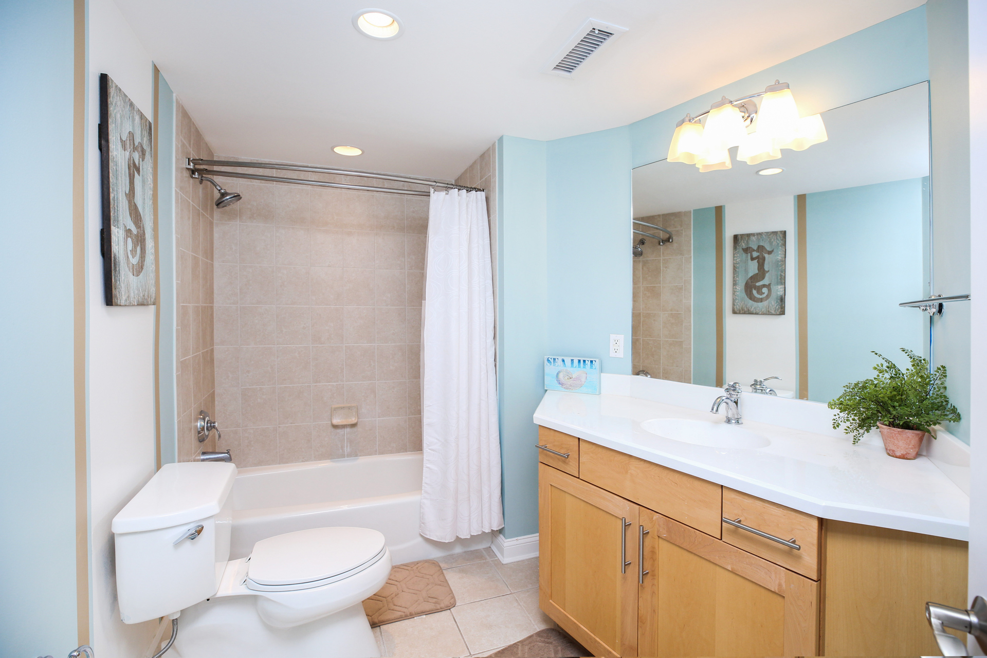 Shared Full Bath with Shower/Tub Combo.