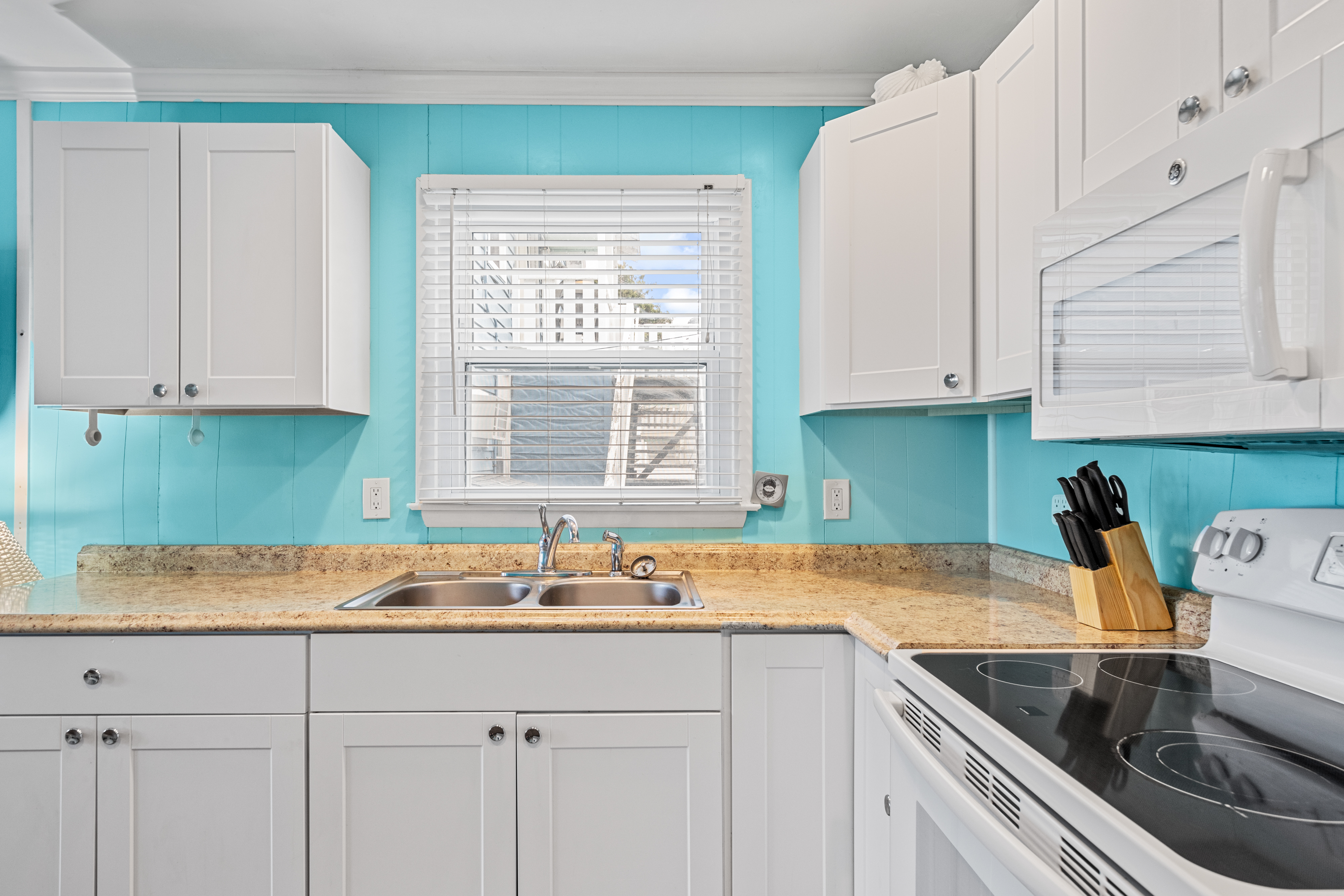 Beautiful, bright white cabinetry and an ample amount of counter space!