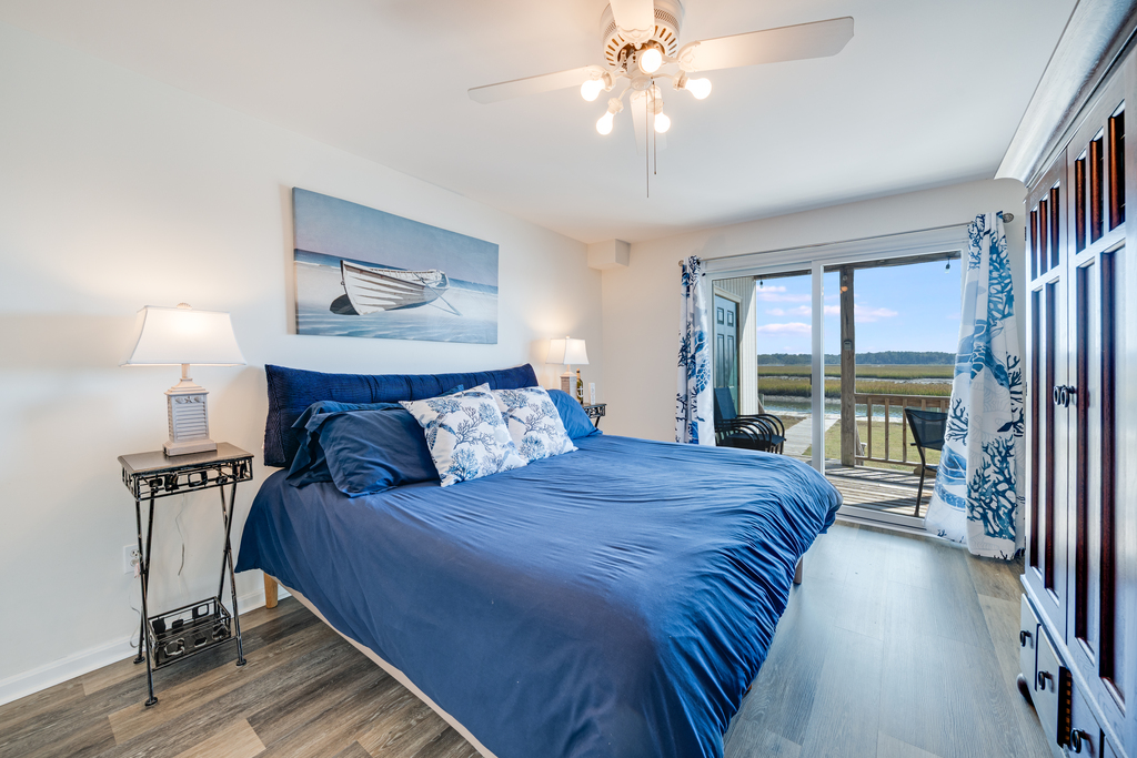 Bedroom 1 is the Primary Bedroom with a King Bed and amazing Bay Views.