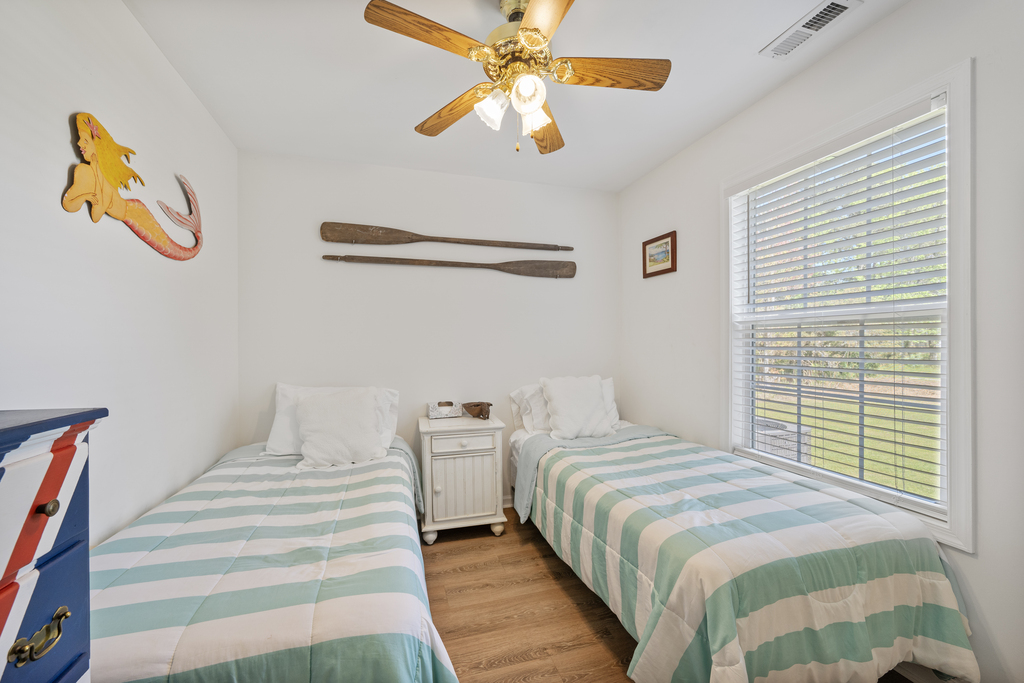 Bedroom 2 has 2 Twins and is dressed in beachy blues.