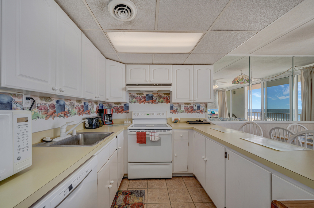 A fresh, inviting Kitchen with coastal charm and crisp white cabinets.
