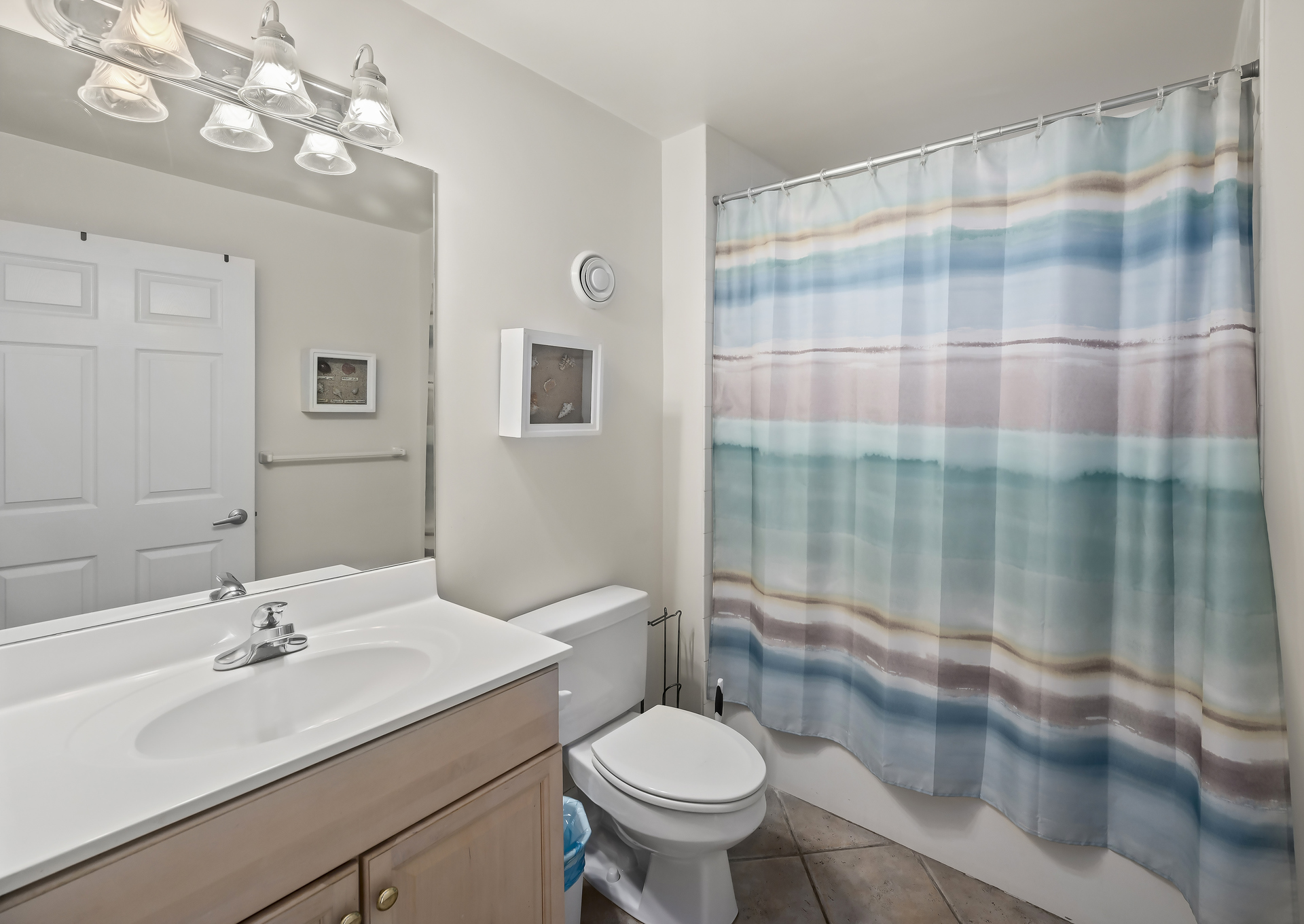 The hall bath hosts a shower/tub combo