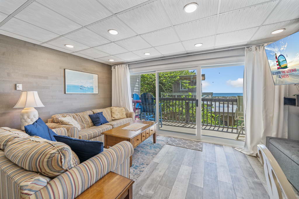 Relax in the comfy living area after a long day on the beach!