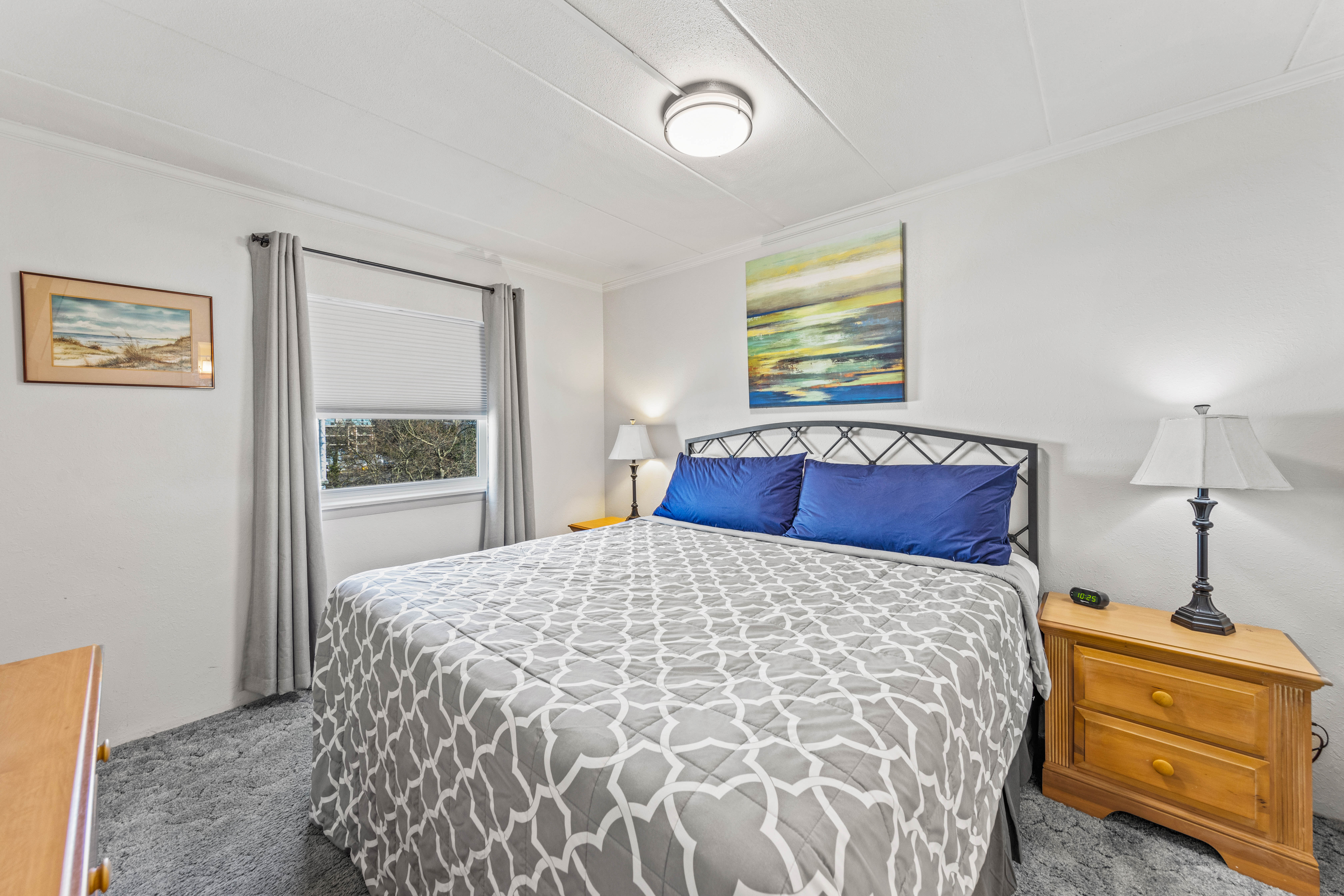 The Cozy Primary Bedroom features a plush King Size Bed.