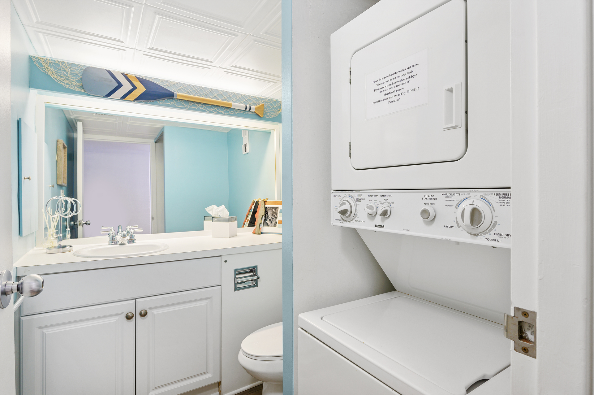 The stacked Washer/Dryer is tucked into the Hall next to the Half Bath.