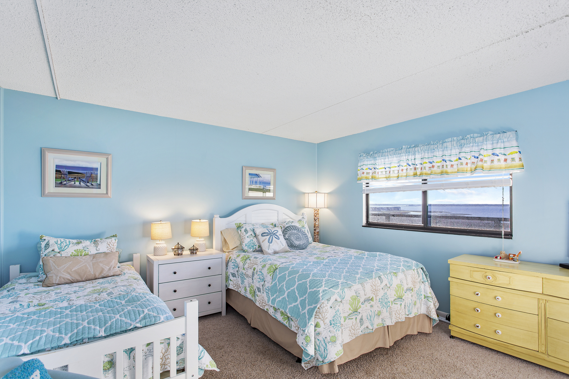 Bedroom 2 offers a Plush Queen Bed & Twin Bed