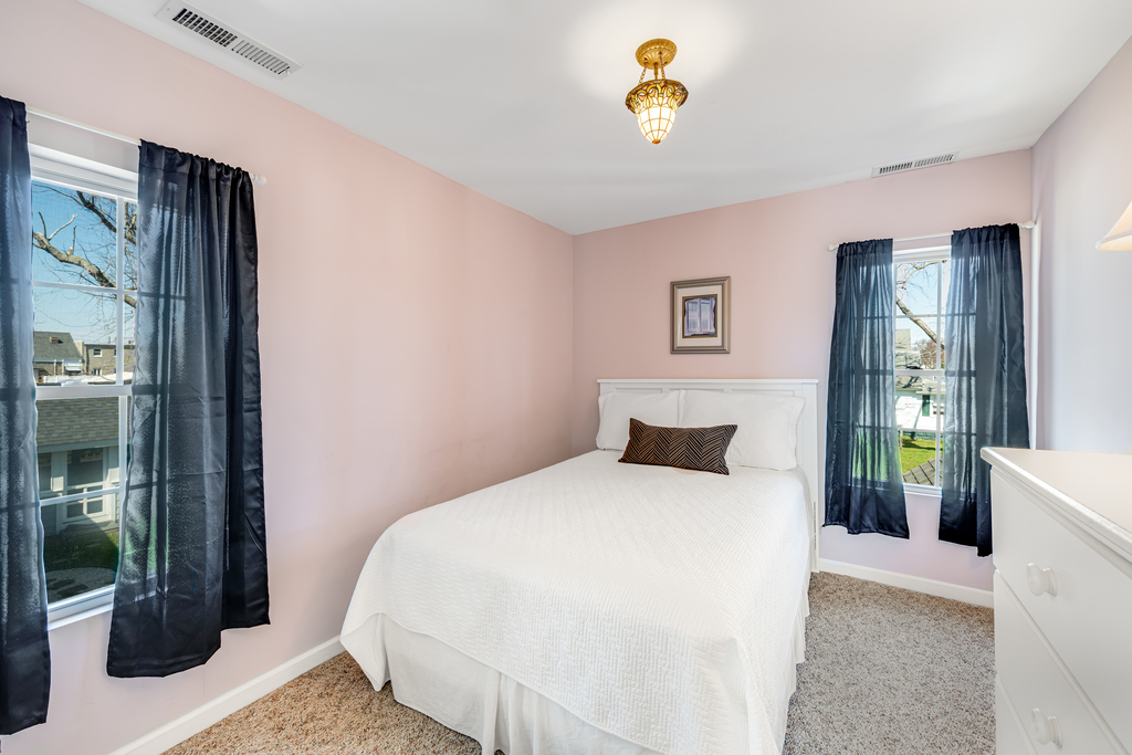 Bedroom 3 is pretty in pink and also has a Full Bed.