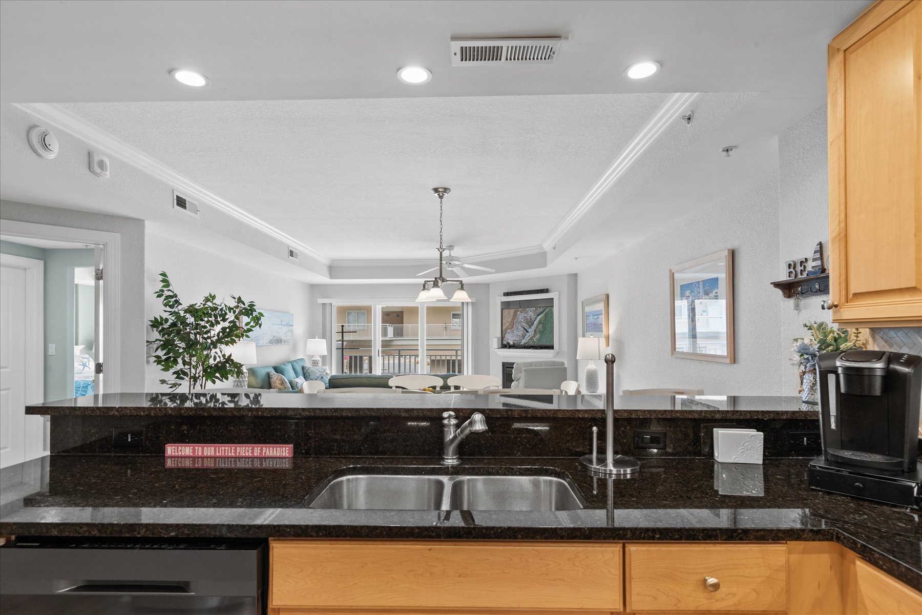 Overlook the Dining and Living Areas while you Meal Prep.