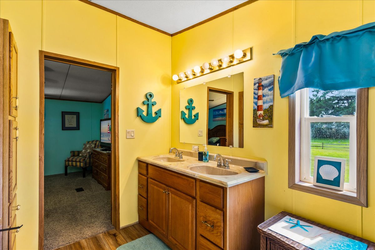 Sunny Yellow Walls and a Double Vanity.