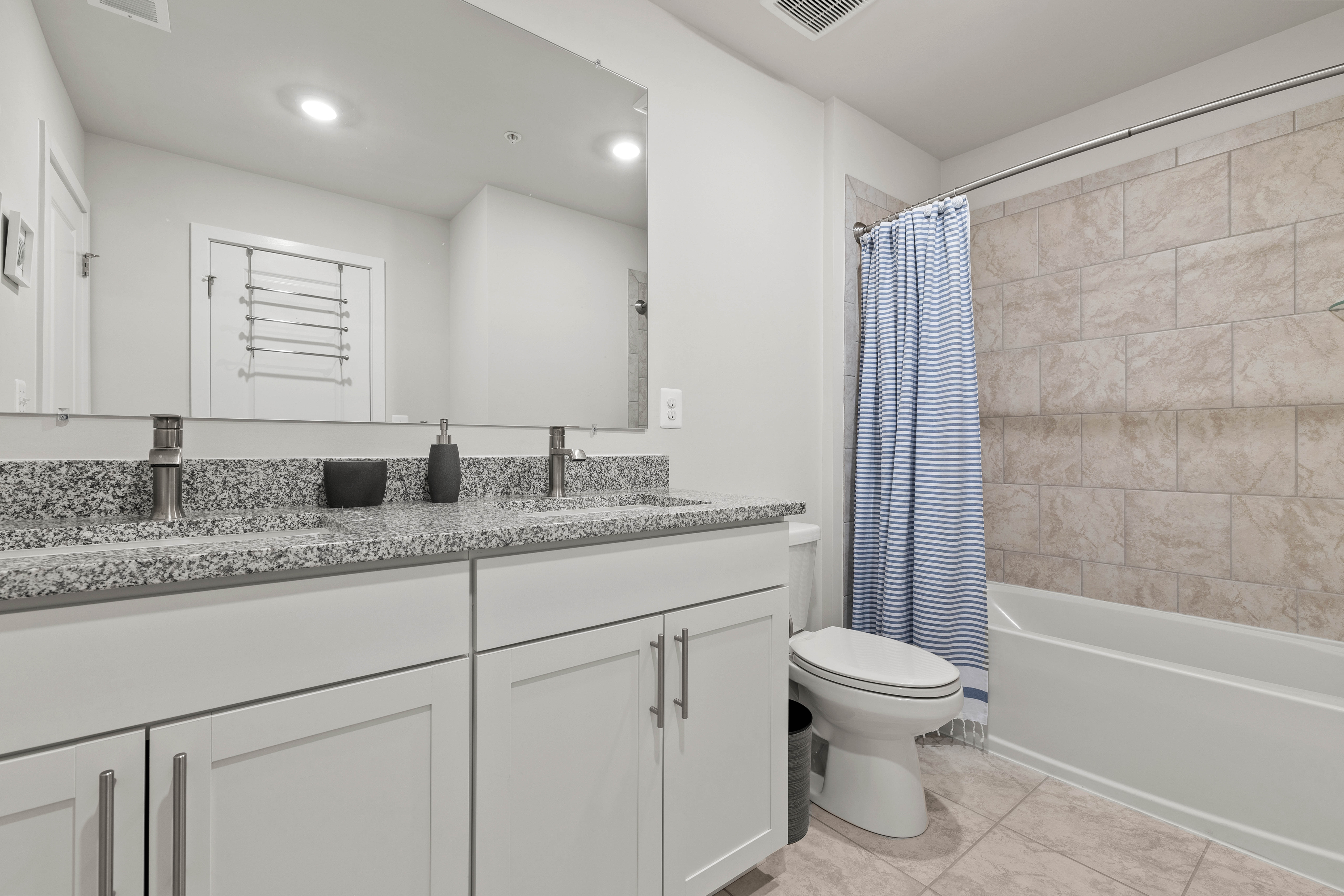 The attached Bath with a Shower/Tub Combo.