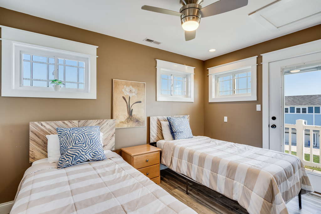 Bedroom 4 is located on the 3rd Floor and has Two Twin Beds