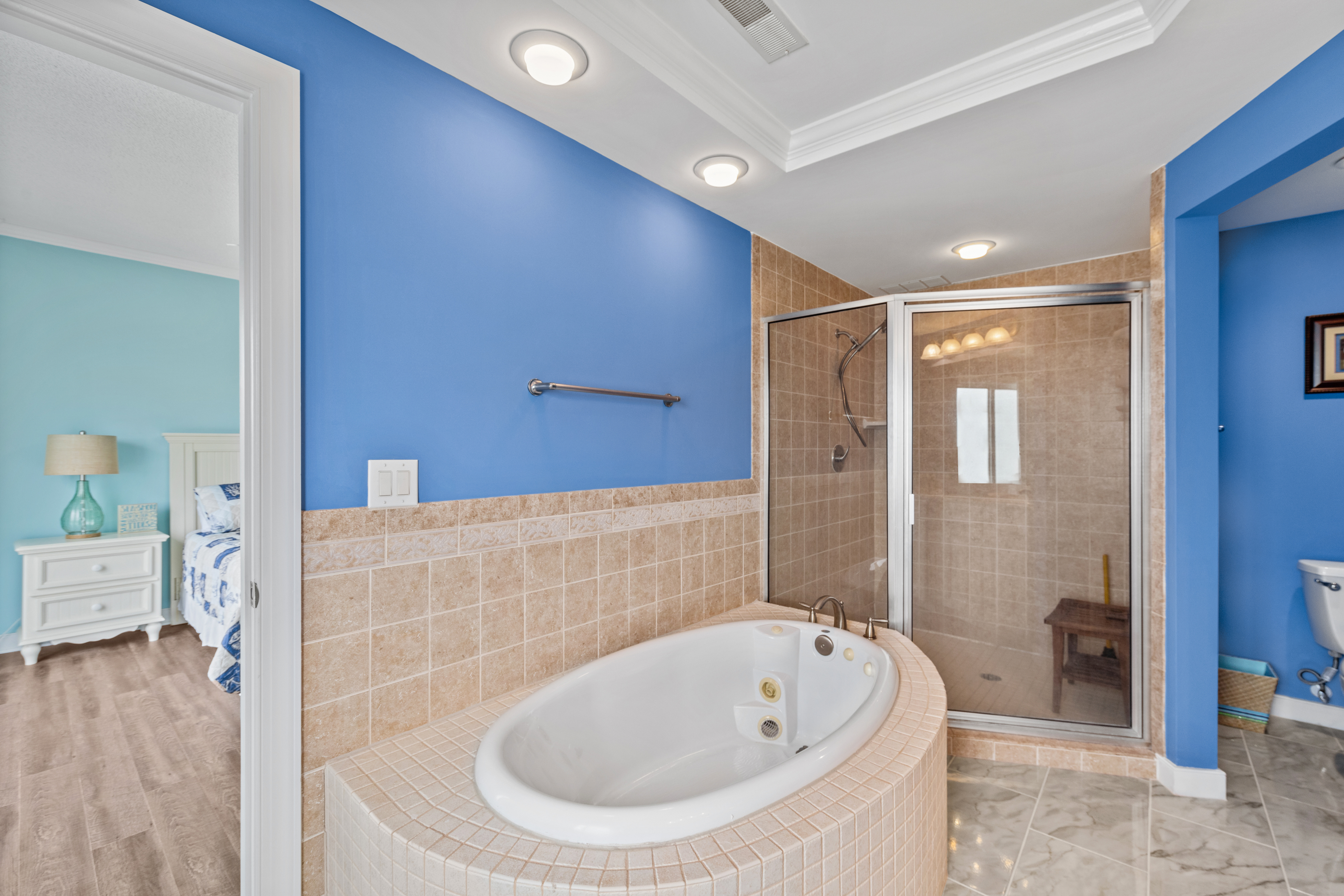 With a Spacious Walk-In Shower and a Soaking Tub.