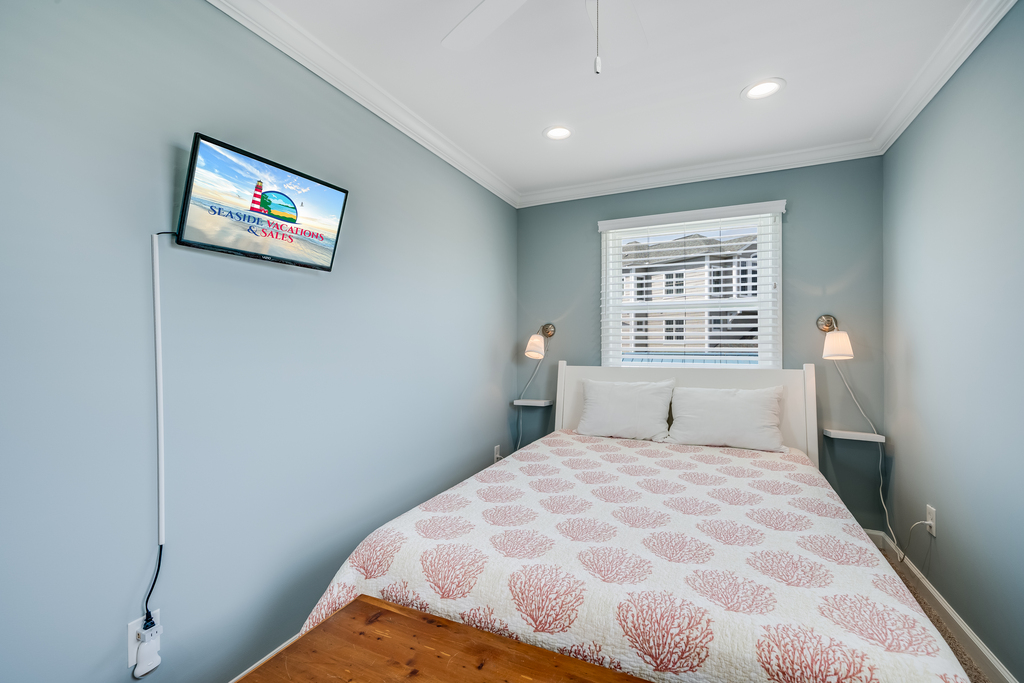 Bedroom 3 has a cozy Queen bed and flat screen TV.
