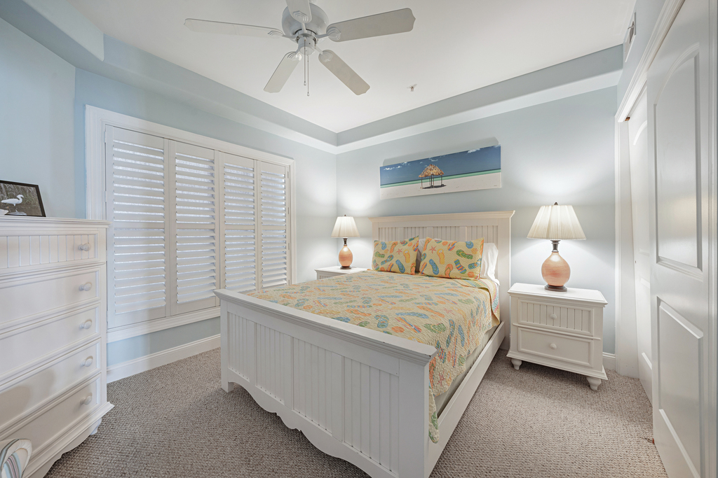 On the other side of the Condo, Bedroom 2 has a Queen Bed and tasteful beachy decor.