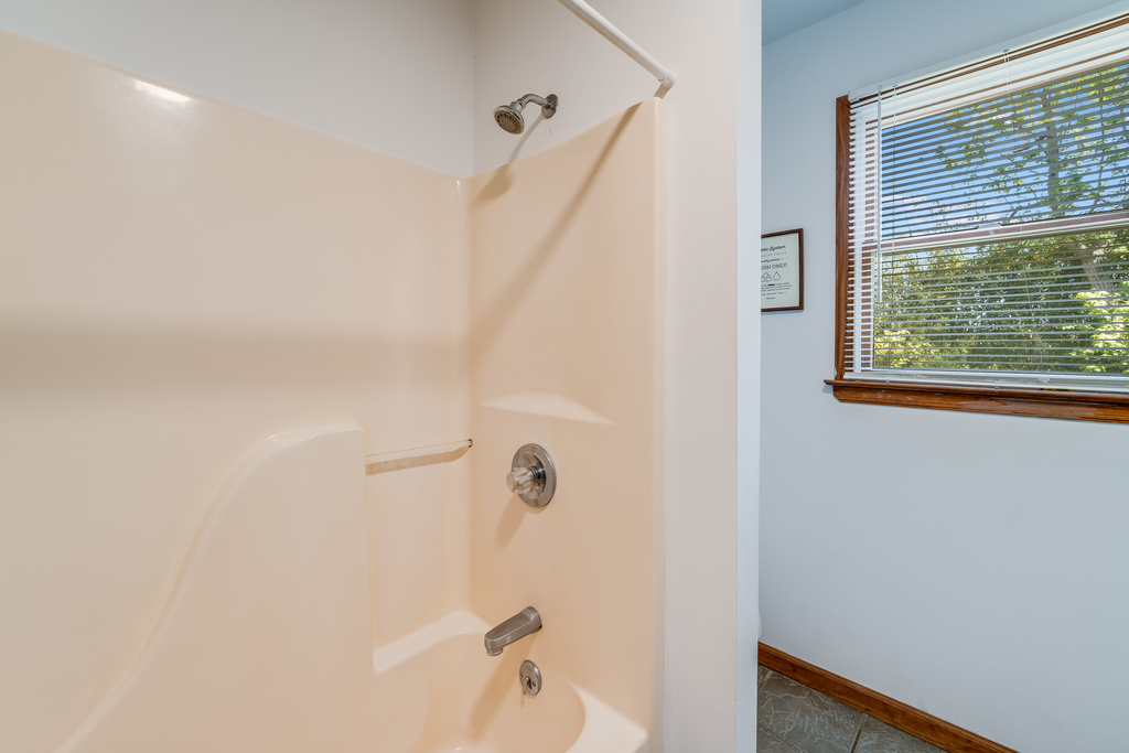 Tub/Shower Combo in downstairs Full Bath.