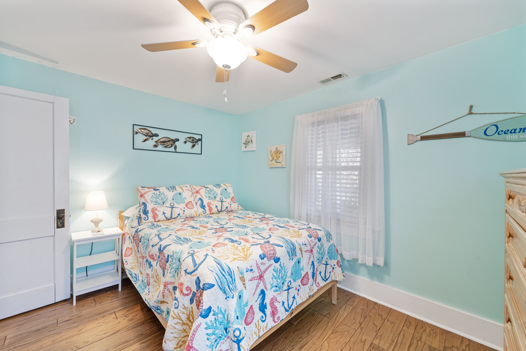 Bedroom 2 has a Full Bed and colors of Sea Glass.