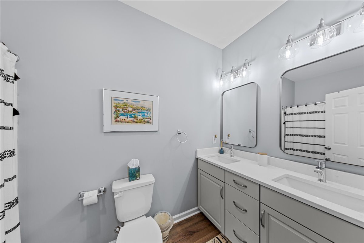 Full Bath 2 is upstairs and shared with a Double Vanity and Tub/Shower Combo.