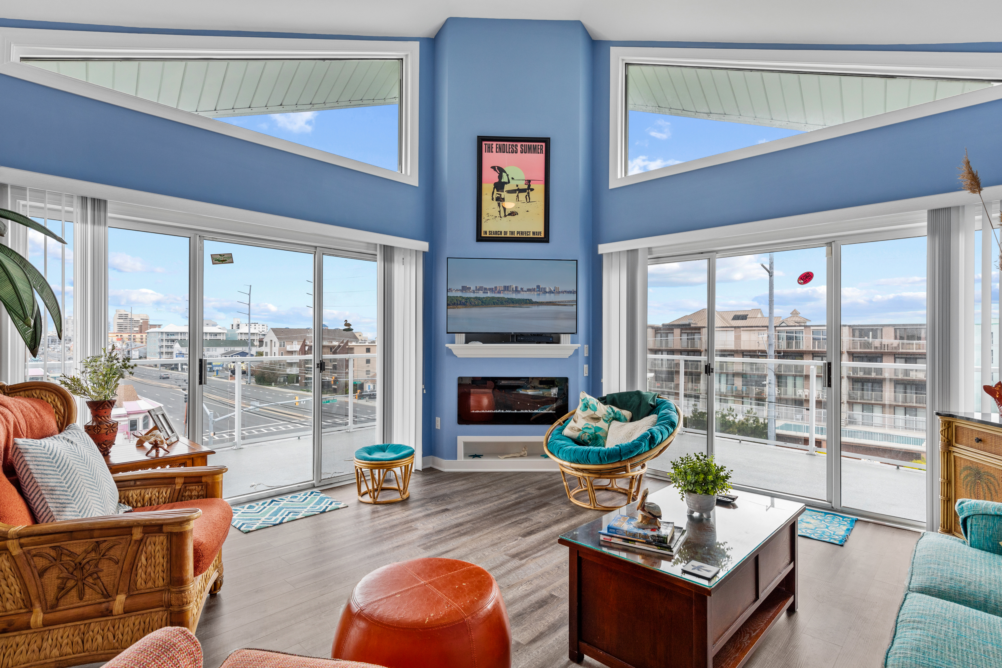Relax in the Living Area with a Wall of Windows, leading to Sweeping Views of Ocean City!