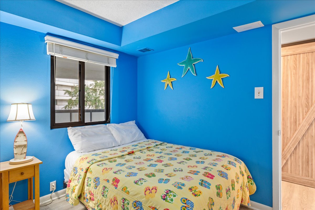 This Bedroom offers 1 Full Bed and a Twin Bunk Bed