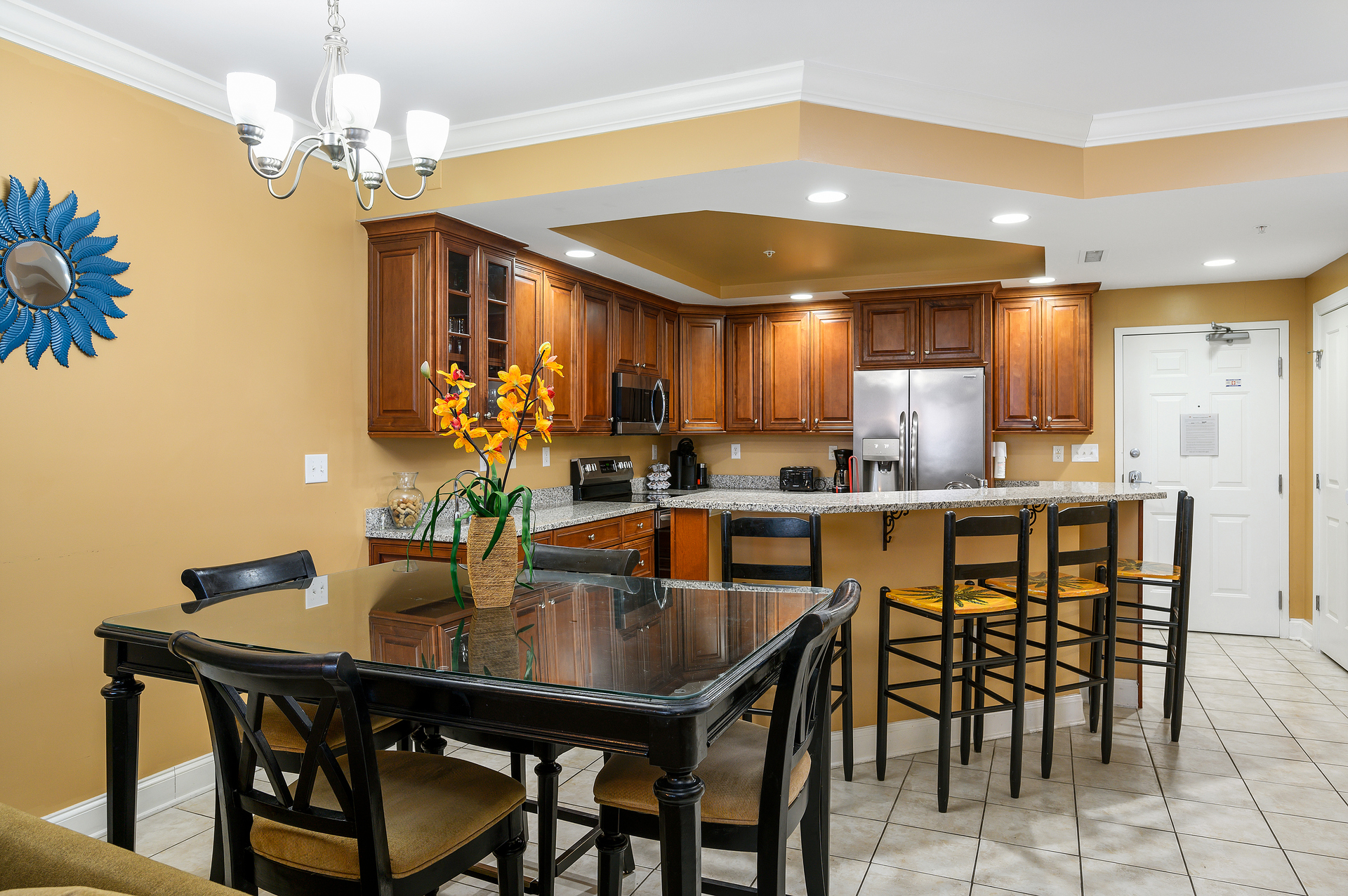 Meal-time is a breeze when dining in here, there is plenty of seating between the Dining Table and the Breakfast Bar.