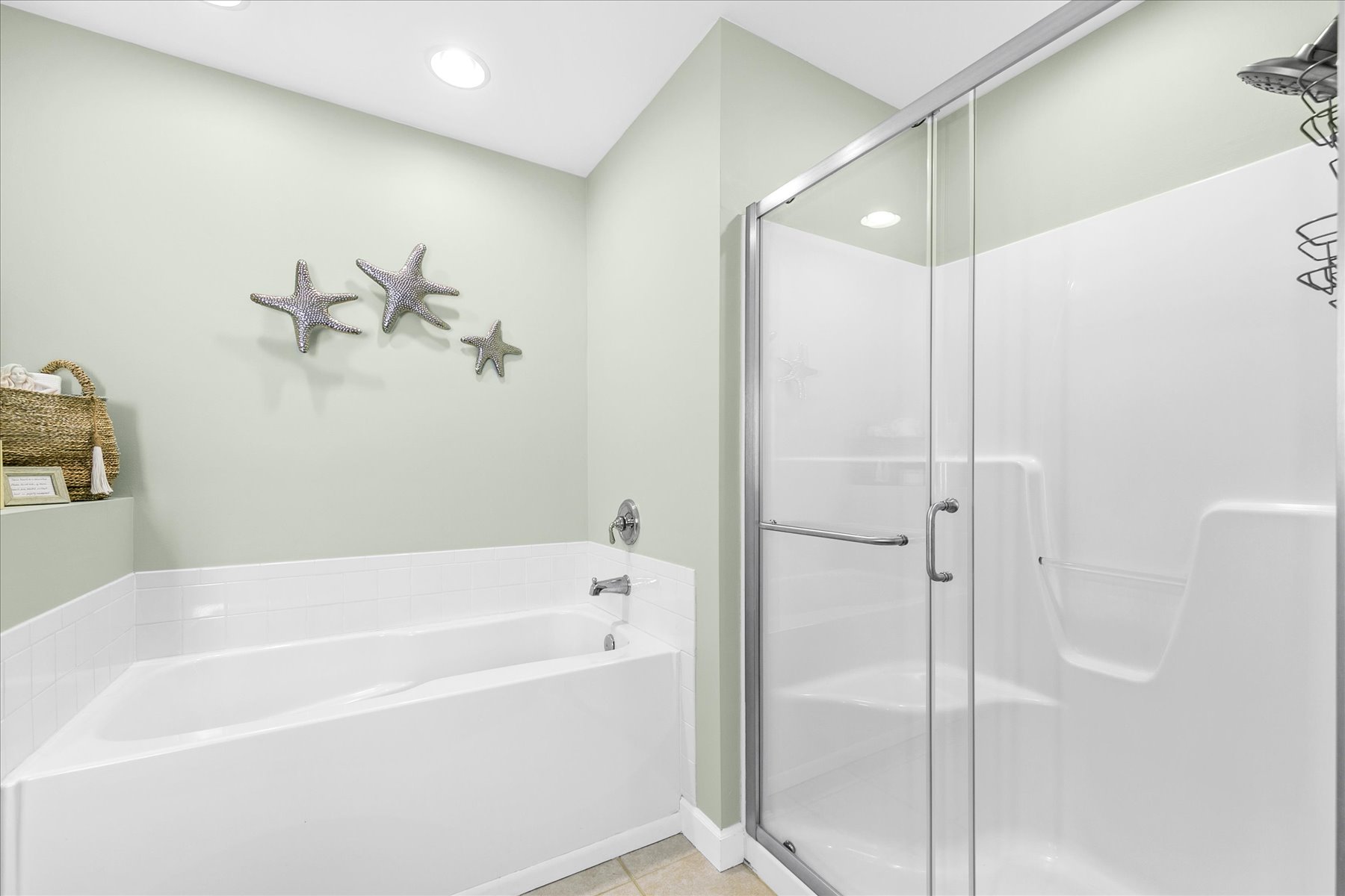 Unwind in your spa-like bathroom featuring a spacious Soaking tub and glass-enclosed Shower