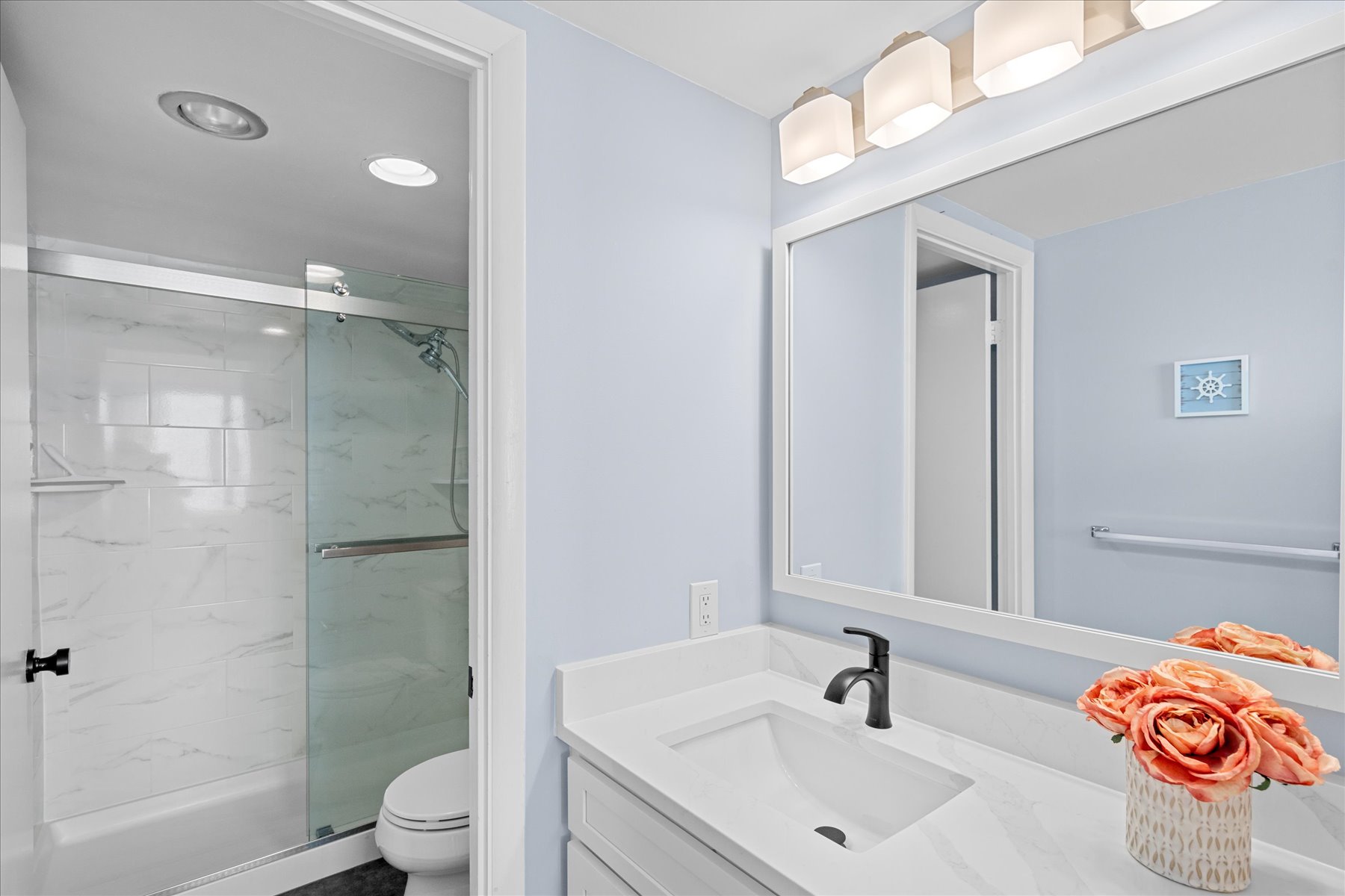 The Primary Bath boasts stunning granite counter tops.