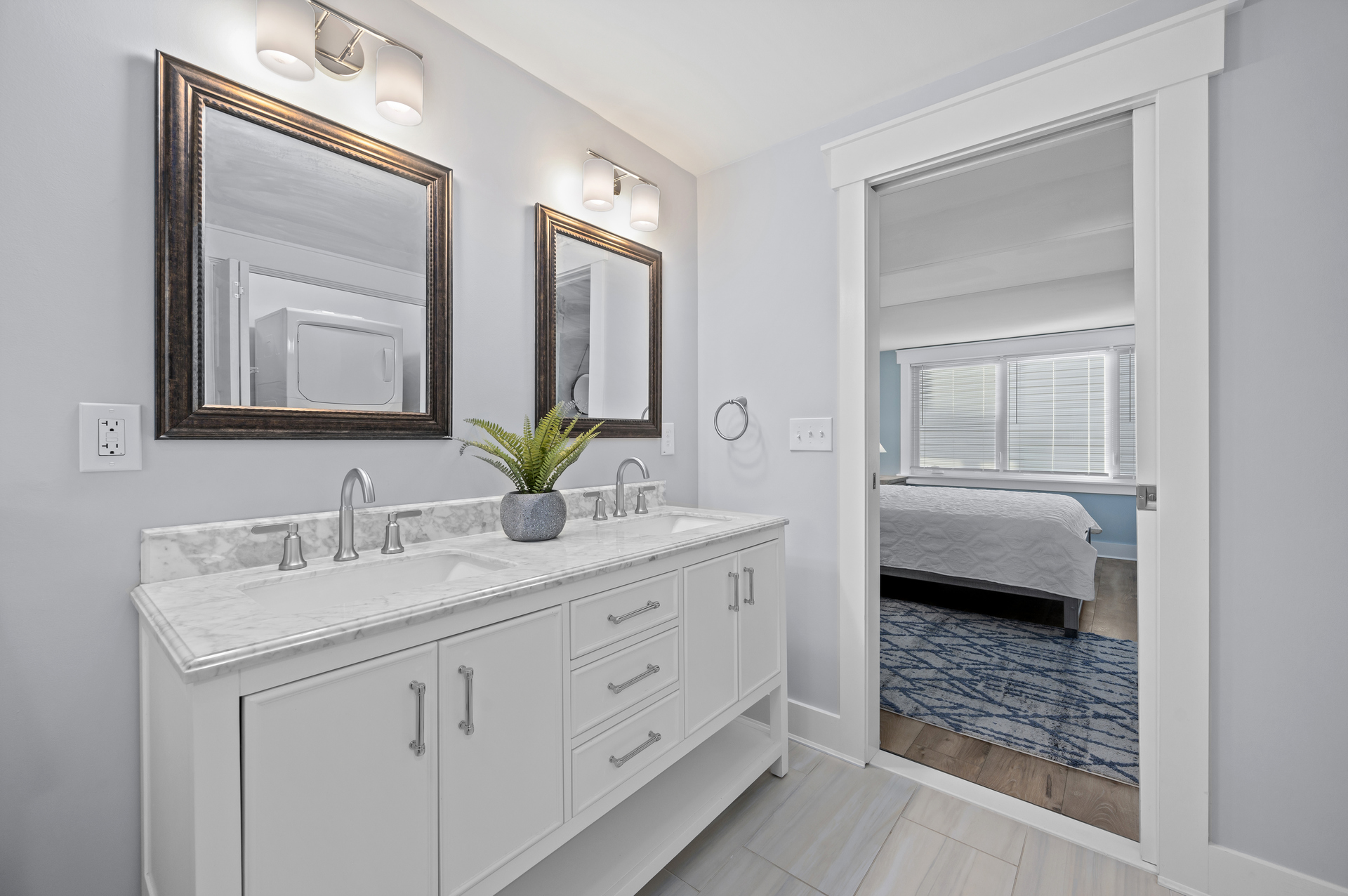 Primary Bath has stunning Double Quartz Vanity.