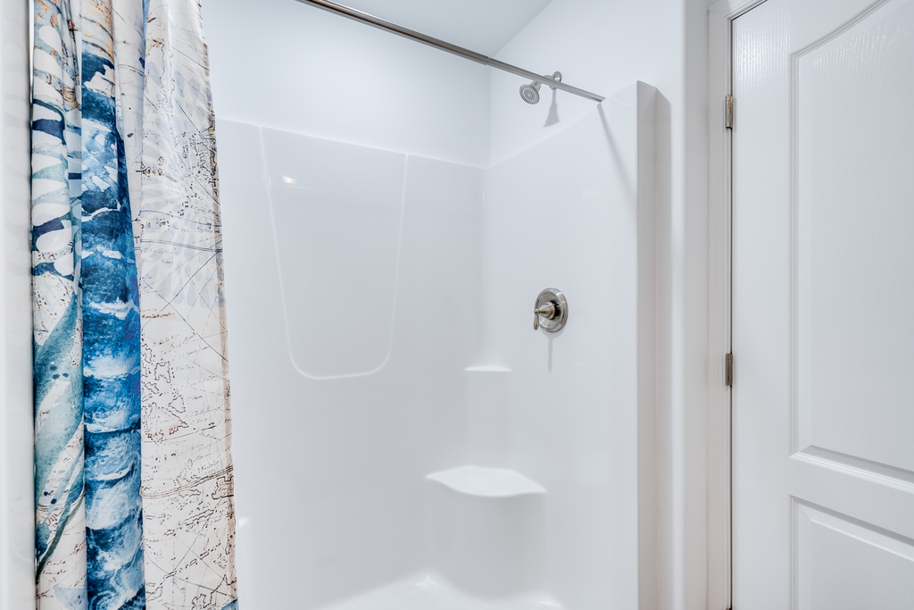 Bedroom 2 has an Attached Bath with Walk-in Shower.