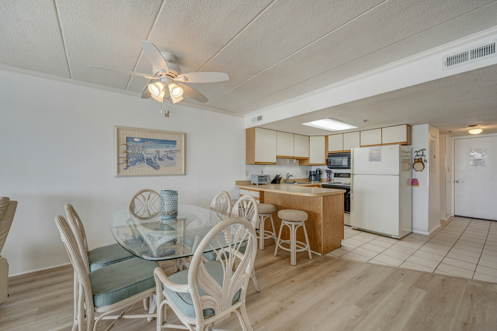 Plenty of seating for the whole family in the dining room/ kitchen area.