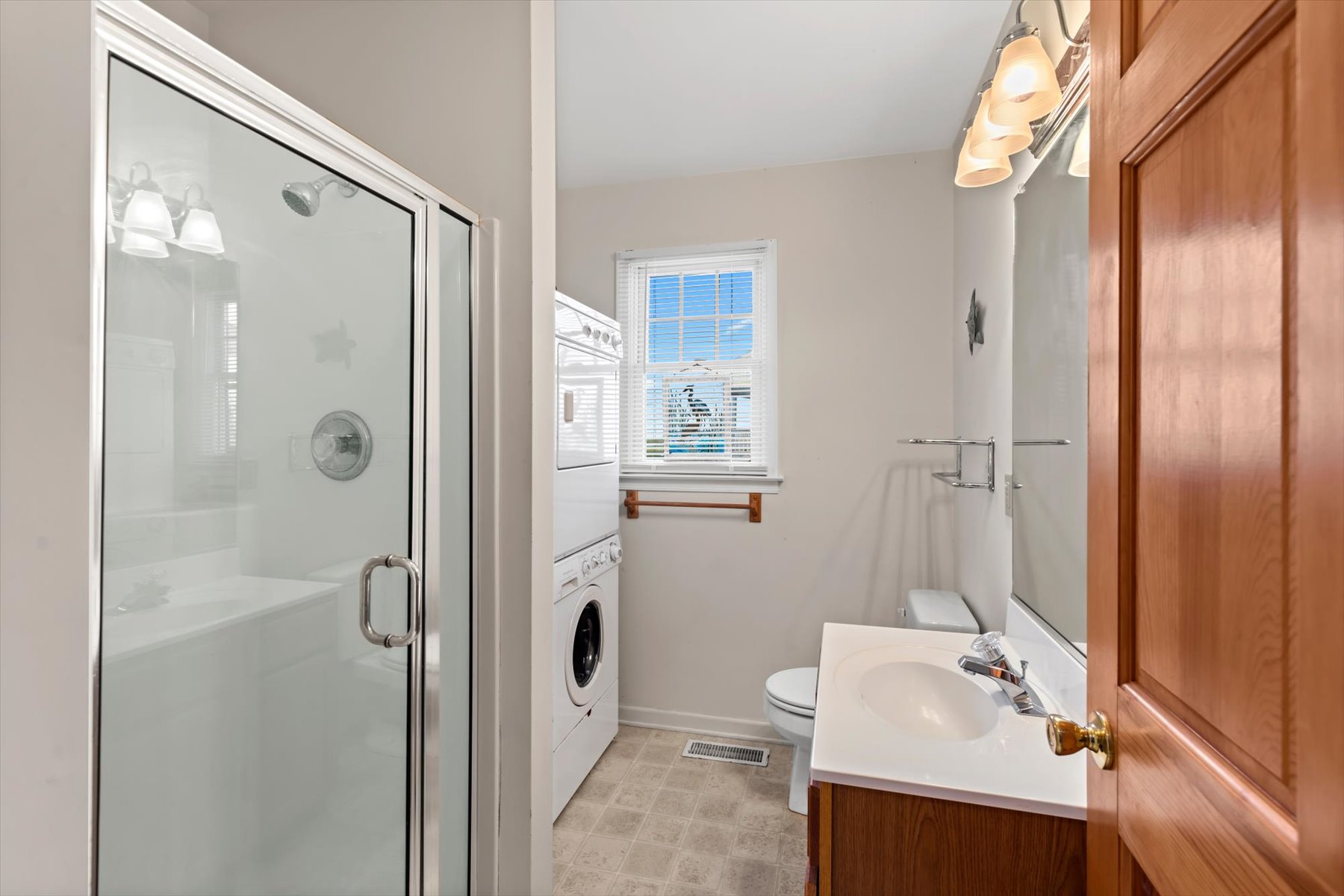 Full Bath 2 has a Walk-in Shower and houses the Washer and Dryer, as well.