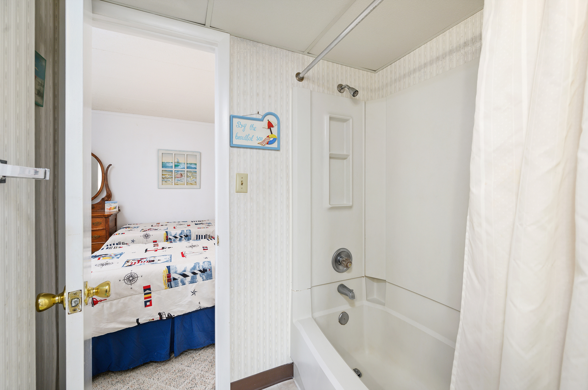 There is a full size Shower/Tub combo, perfect for washing off the sand.