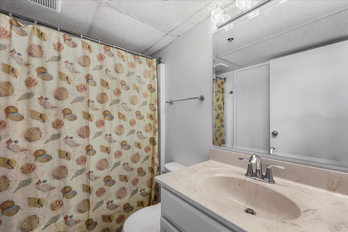 Freshen Up in the Full Shared Bath, offering a Shower/Tub Combo!