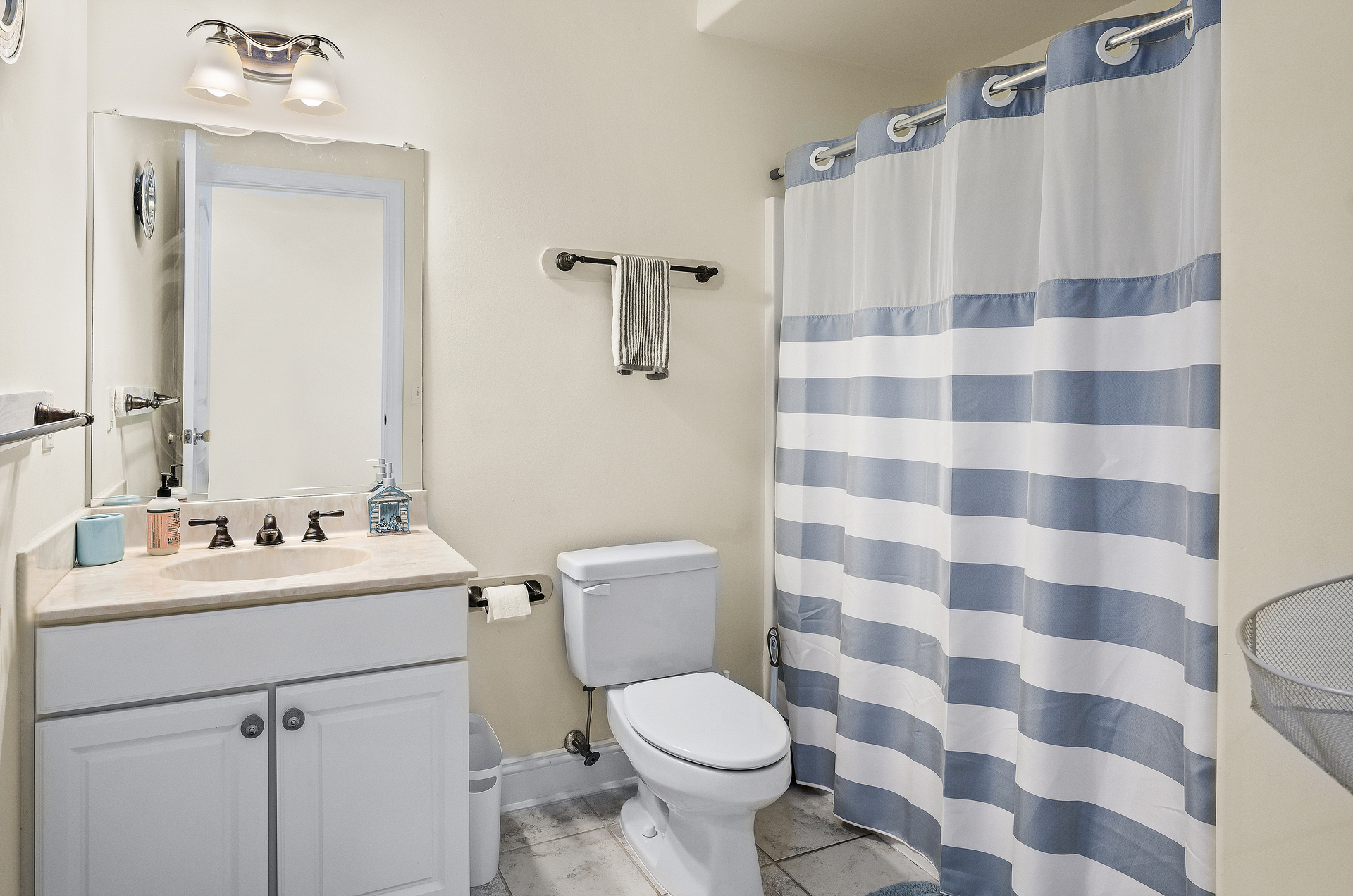 Shared Full Bath with Tub/Shower Combo in Hall.